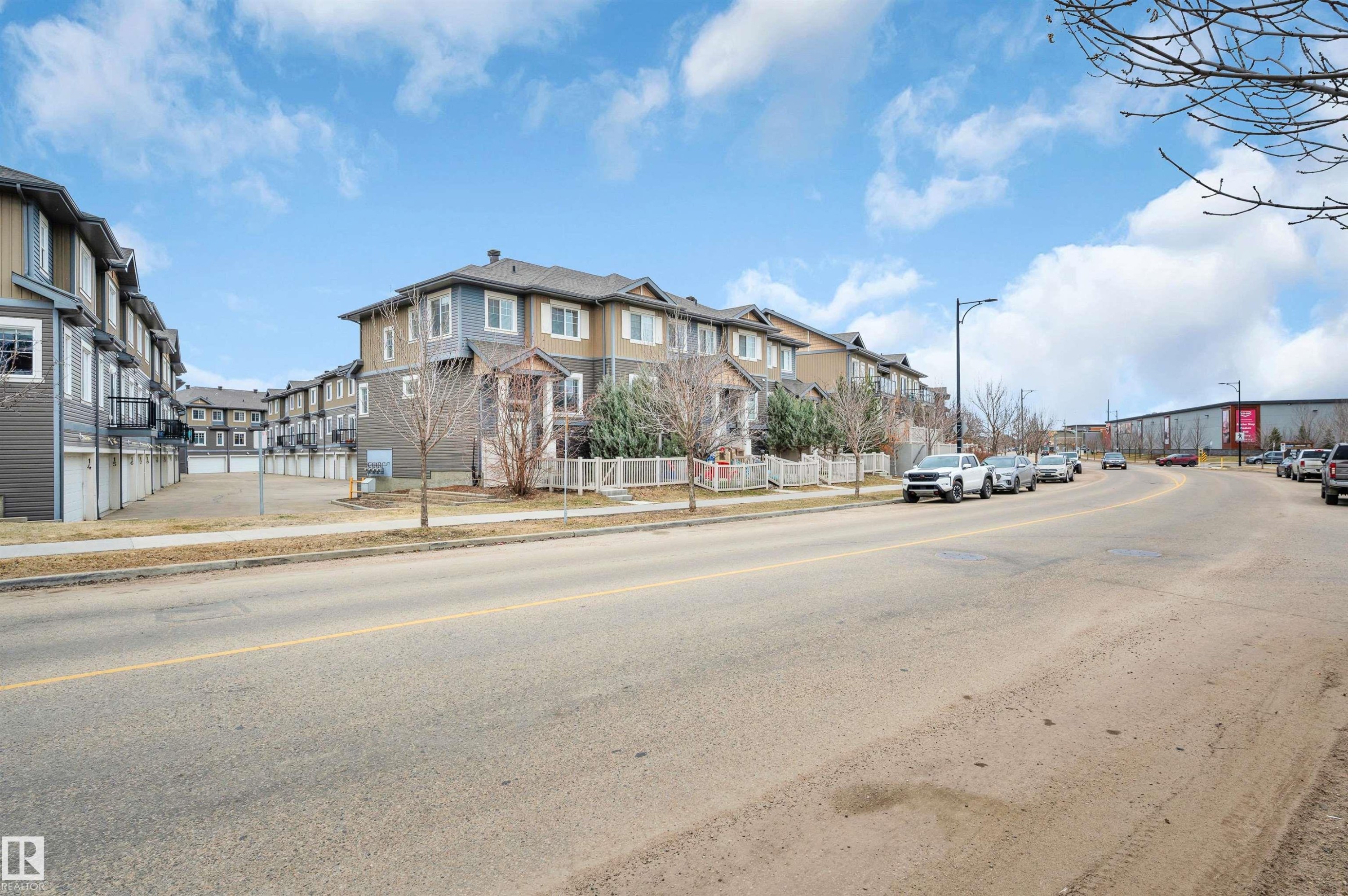 Multi-story townhome with neutral siding and white trim - 13 1030 Chappelle Boulevard, Edmonton, AB - Outdoor