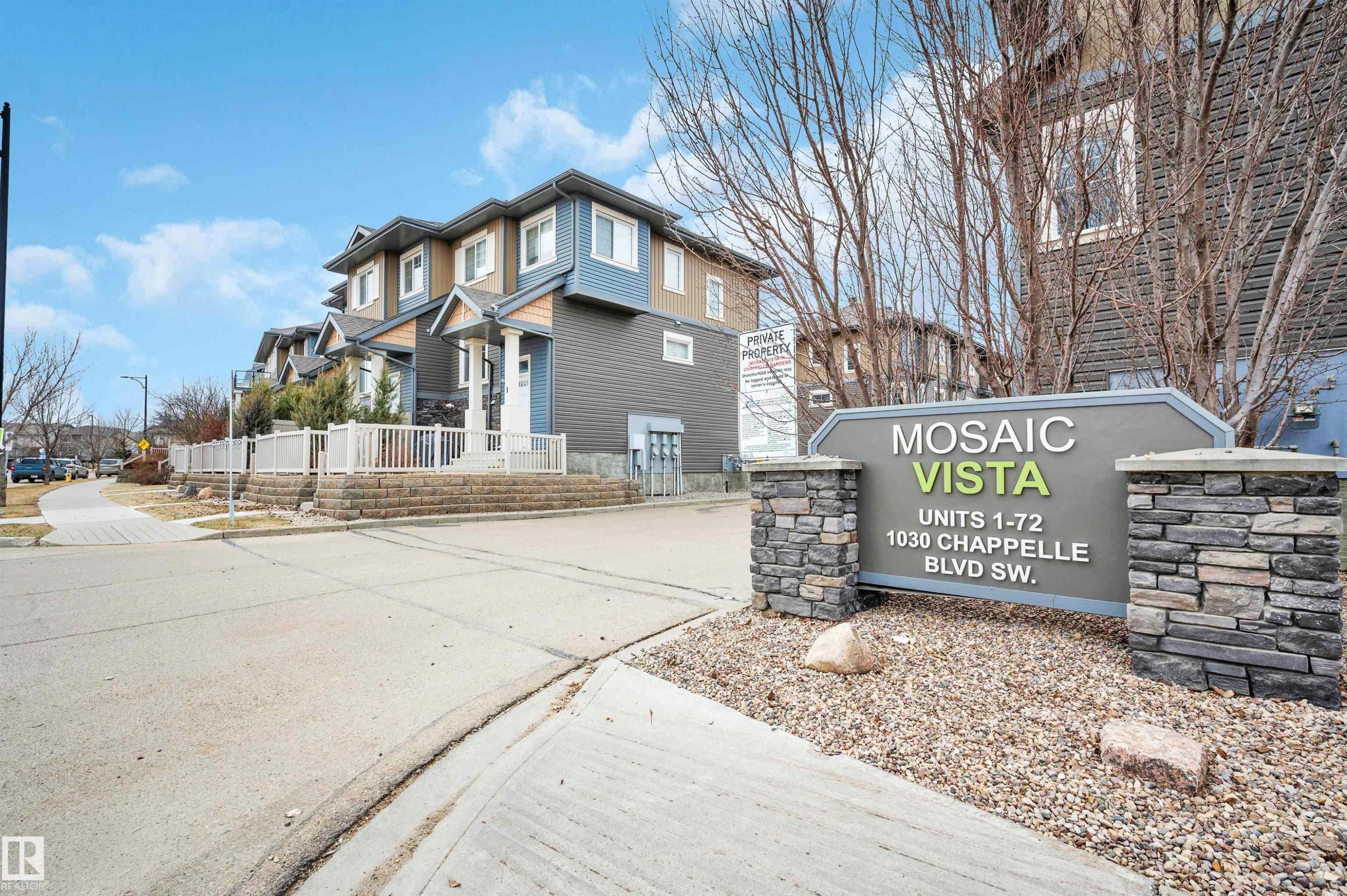 Mosaic Vista community sign featuring stone pillars and a dark grey and green color scheme - 13 1030 Chappelle Boulevard, Edmonton, AB - Outdoor