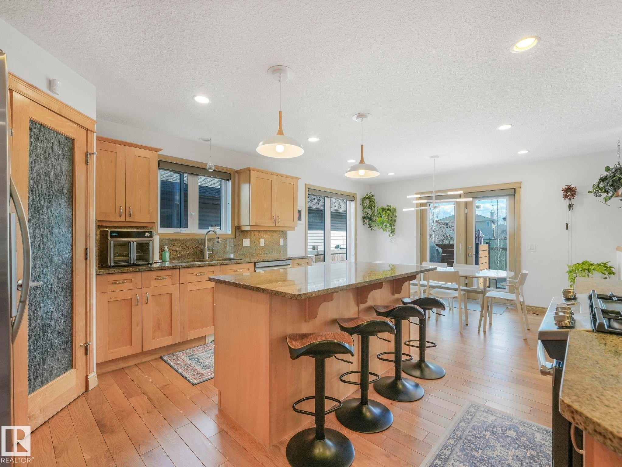 Large Chefs kitchen with an island perfect for prepping, eating and entertaining! - 8723 207 Street Nw, Edmonton, AB - Indoor Photo Showing Kitchen With Upgraded Kitchen