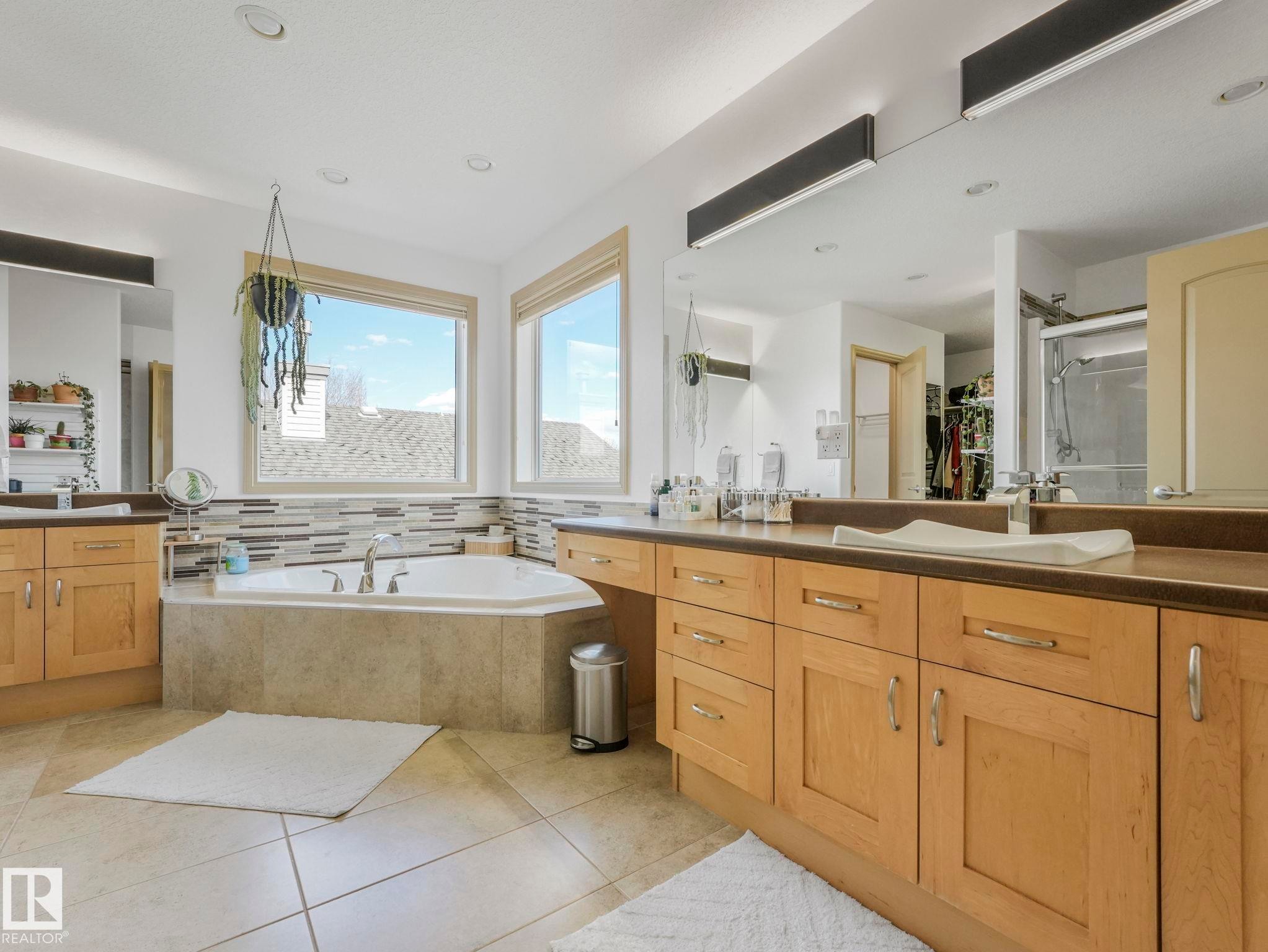 Large Primary Bathroom - Seperate sinks and vanities, jet tub, shower, and a seperate room for the toilet! - 8723 207 Street Nw, Edmonton, AB - Indoor Photo Showing Bathroom