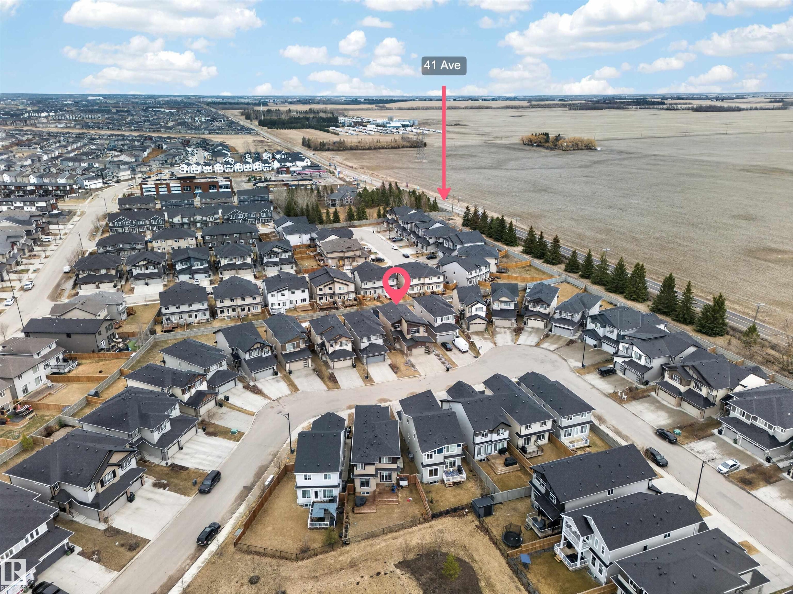 Aerial perspective showcasing a residential community with varied architectural styles - 7414 Chivers Crescent Sw, Edmonton, AB - Outdoor With View