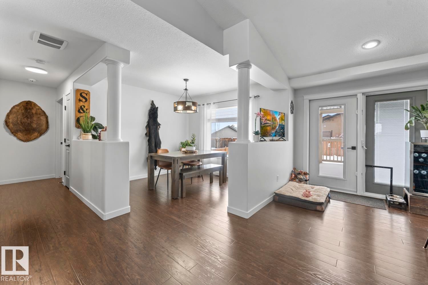 Open-concept living space featuring wood-finish flooring, white walls, and recessed lighting - 4926 58 Ave, Cold Lake, AB - Indoor Photo Showing Other Room