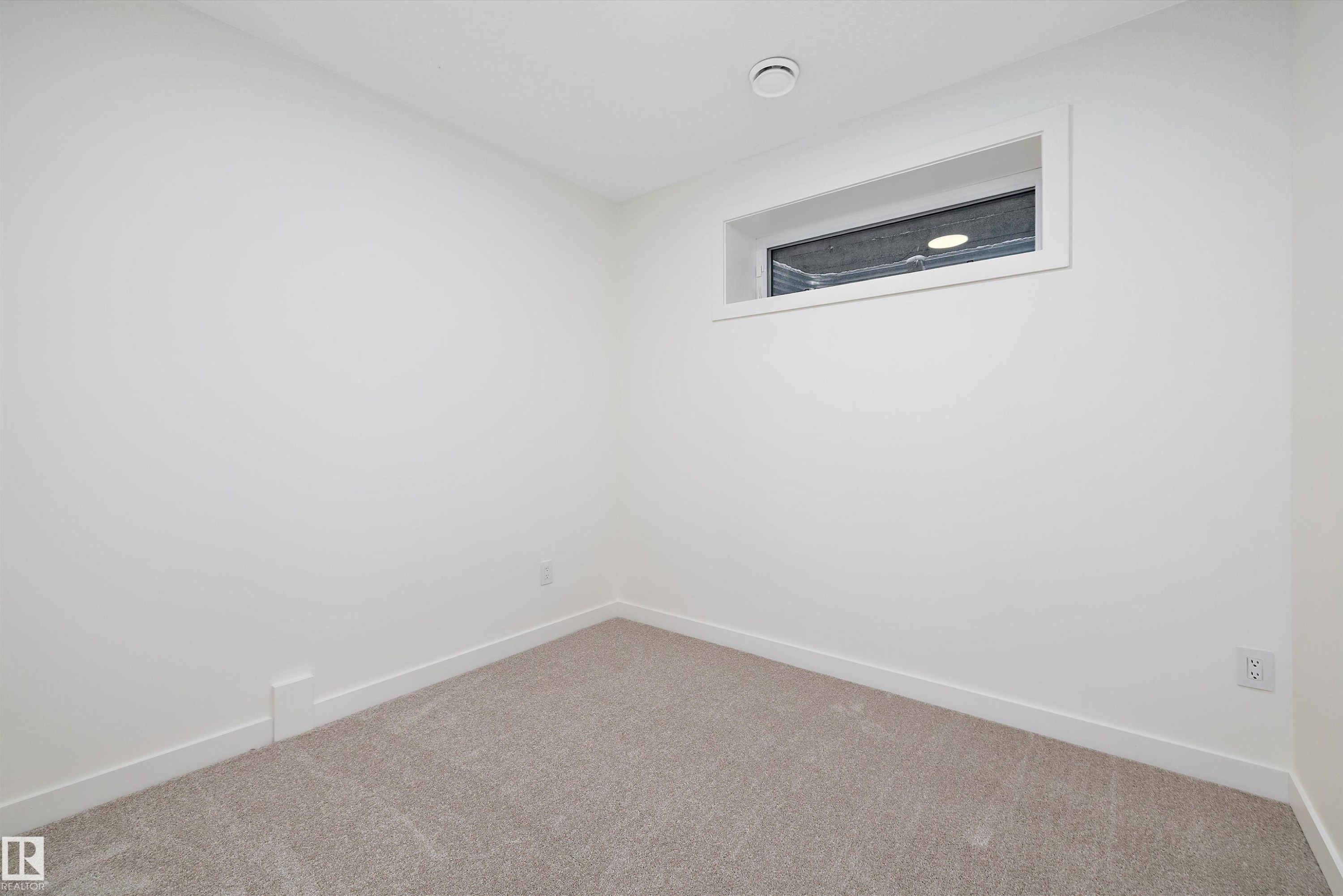 Neutral tone carpeting - 11418 96 Street, Edmonton, AB - Indoor Photo Showing Other Room