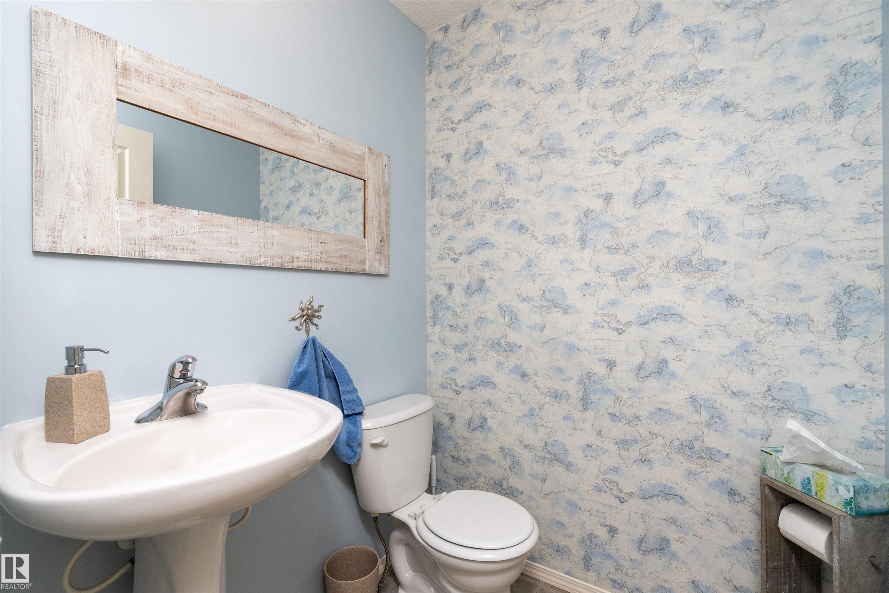 Interior room with neutral walls featuring a painted blue and orange accent stripe - 59 Rue Monette, Beaumont, AB