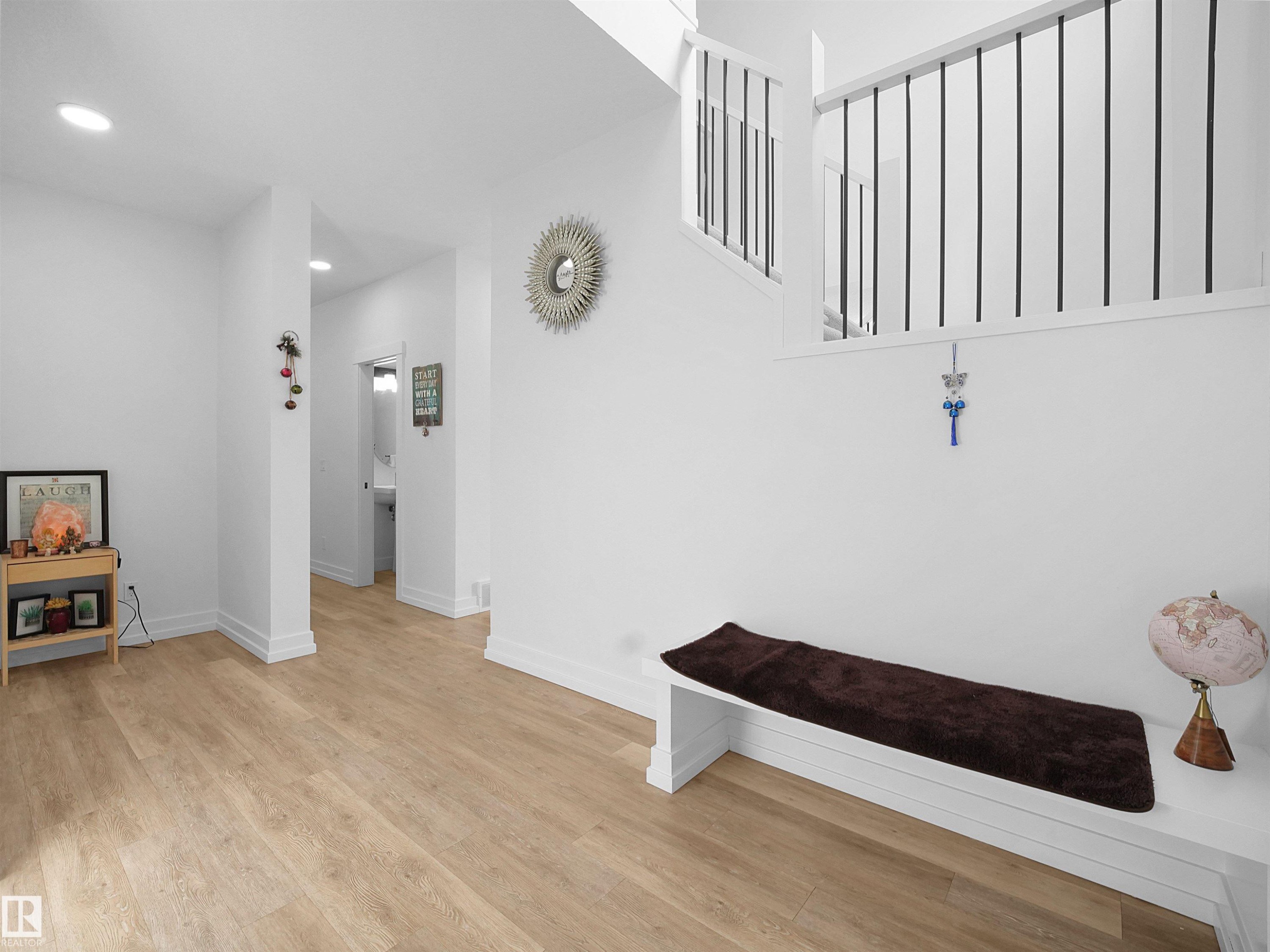 Bright interior space featuring light-toned flooring and white walls, with recessed lighting - 4231 Charles Close, Edmonton, AB - Indoor Photo Showing Other Room