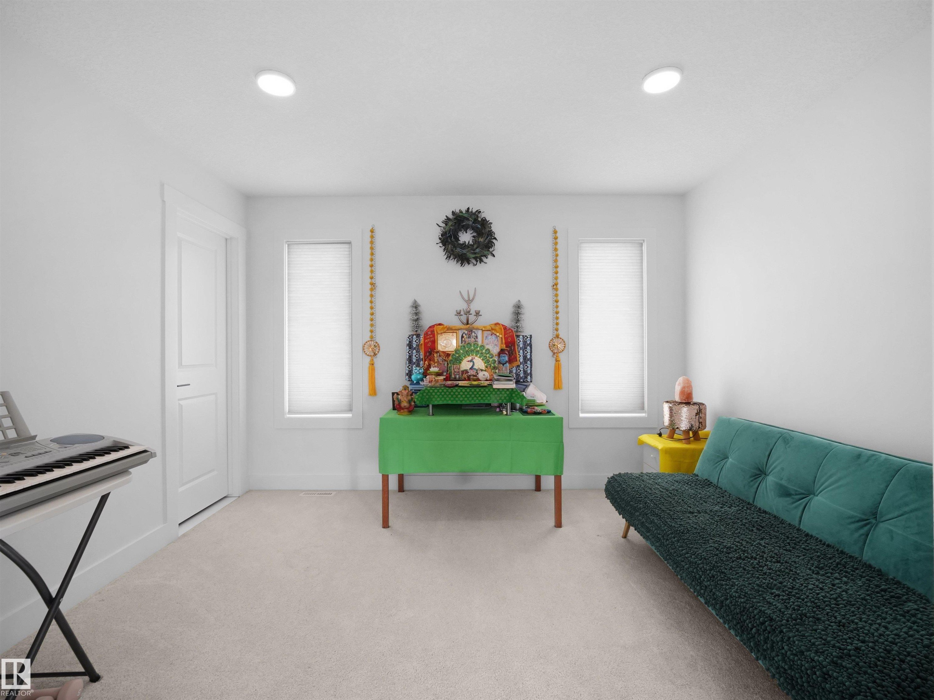 This room features light-colored carpeting, white walls, and recessed lighting - 4231 Charles Close, Edmonton, AB - Indoor
