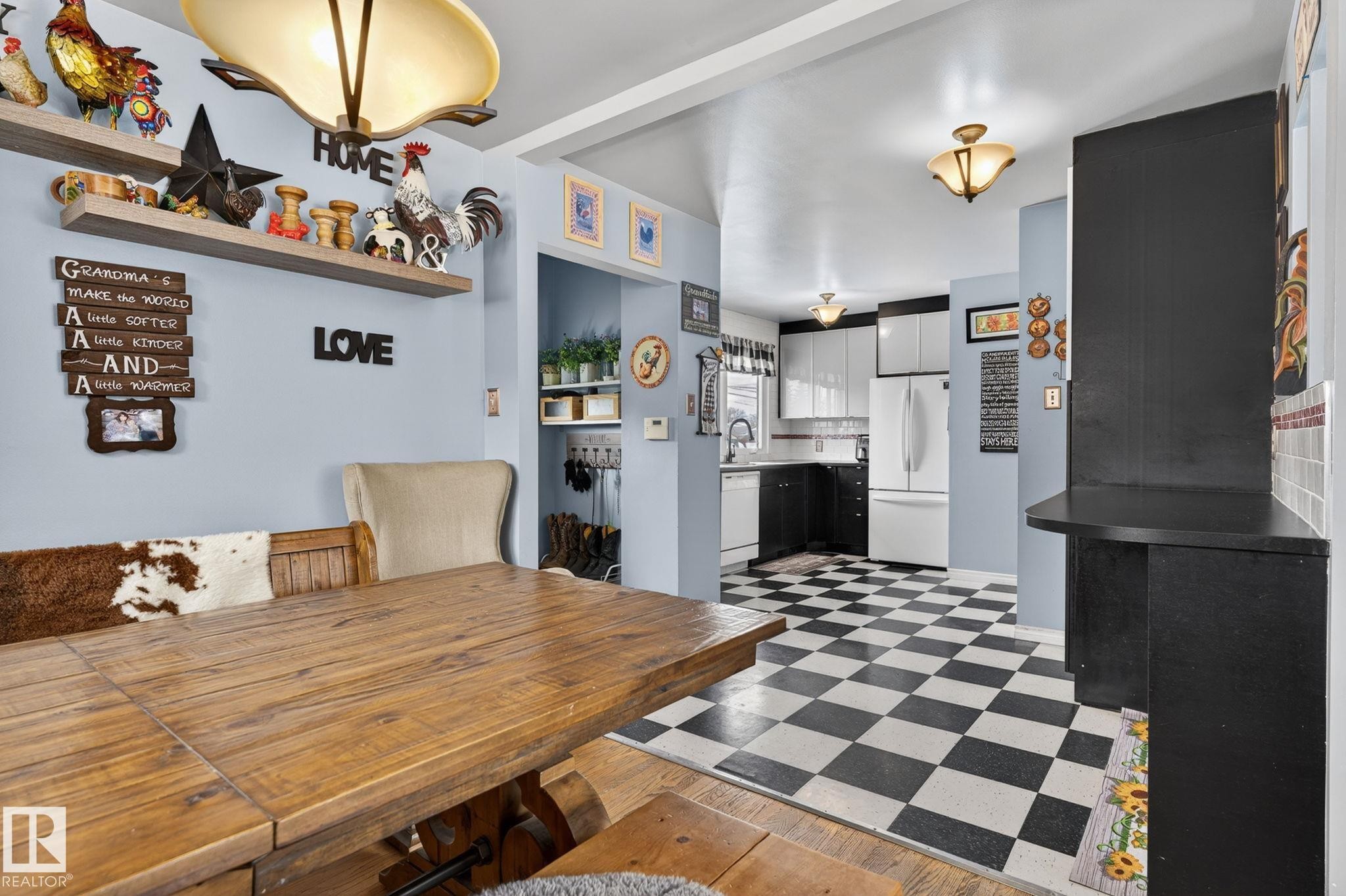 Dining area with built-in shelving, featuring a wood-finish dining surface - 9112 130 Avenue, Edmonton, AB - Indoor Photo Showing Dining Room