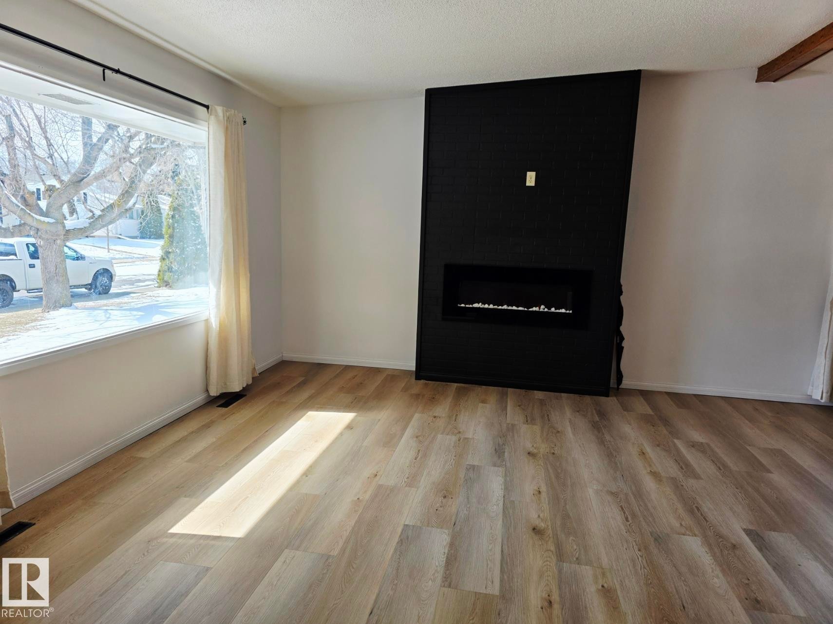5204 43 Avenue, Leduc, AB - Indoor Photo Showing Living Room With Fireplace
