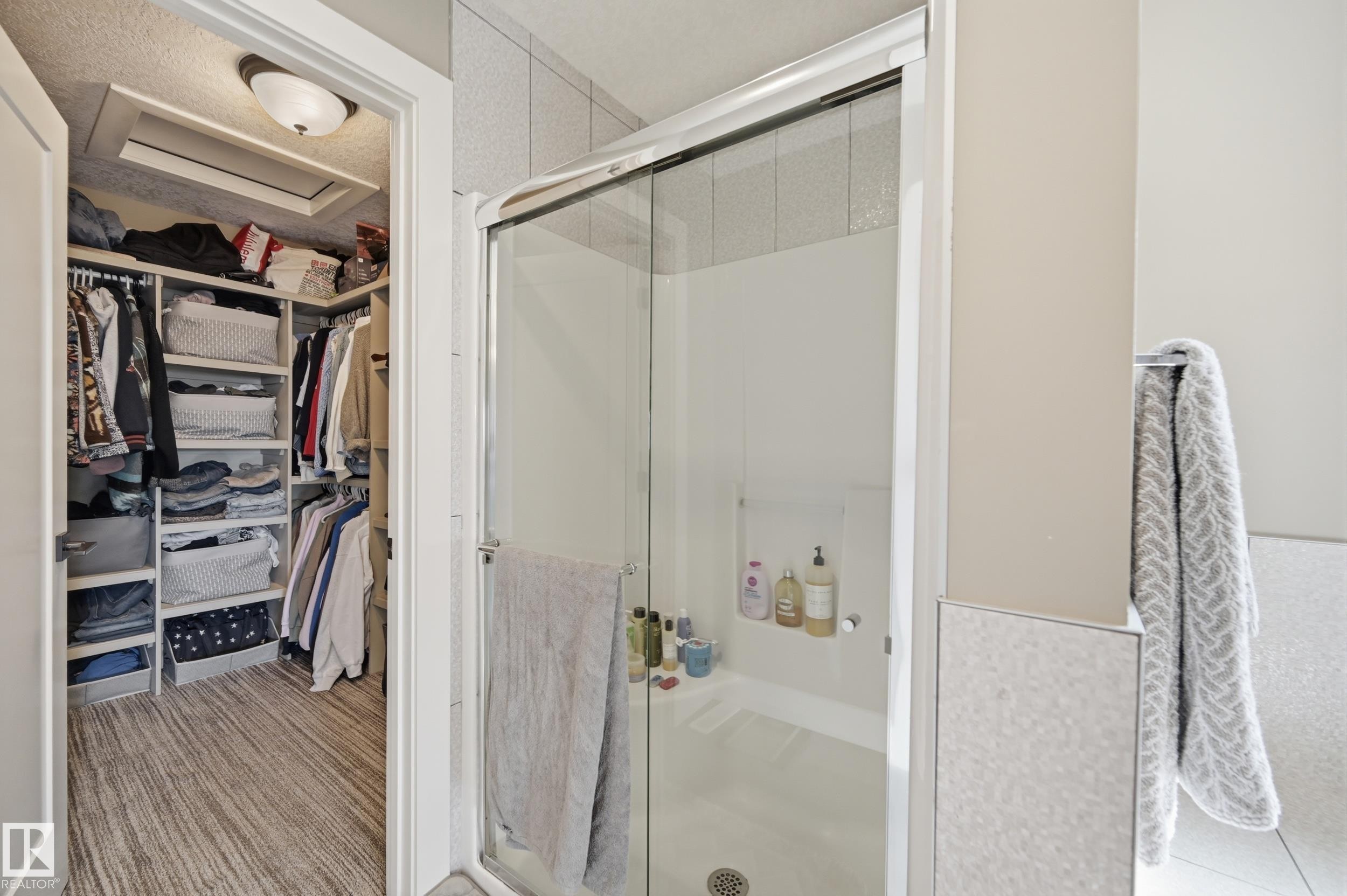 The bathroom features a glass-enclosed shower and a towel bar - 2018 Armitage Green, Edmonton, AB - Indoor Photo Showing Bathroom