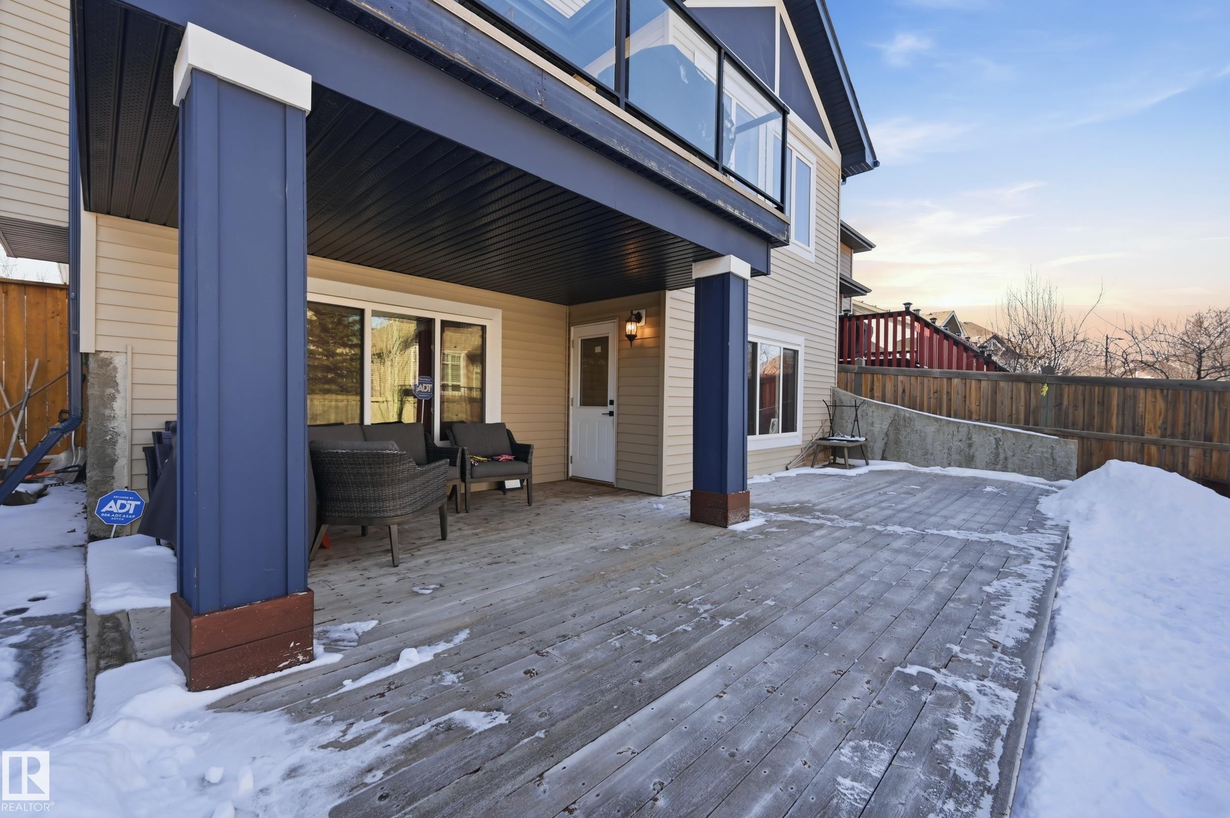 The property features a large wooden deck, offering ample outdoor living space - 2018 Armitage Green, Edmonton, AB - Outdoor With Deck Patio Veranda With Exterior