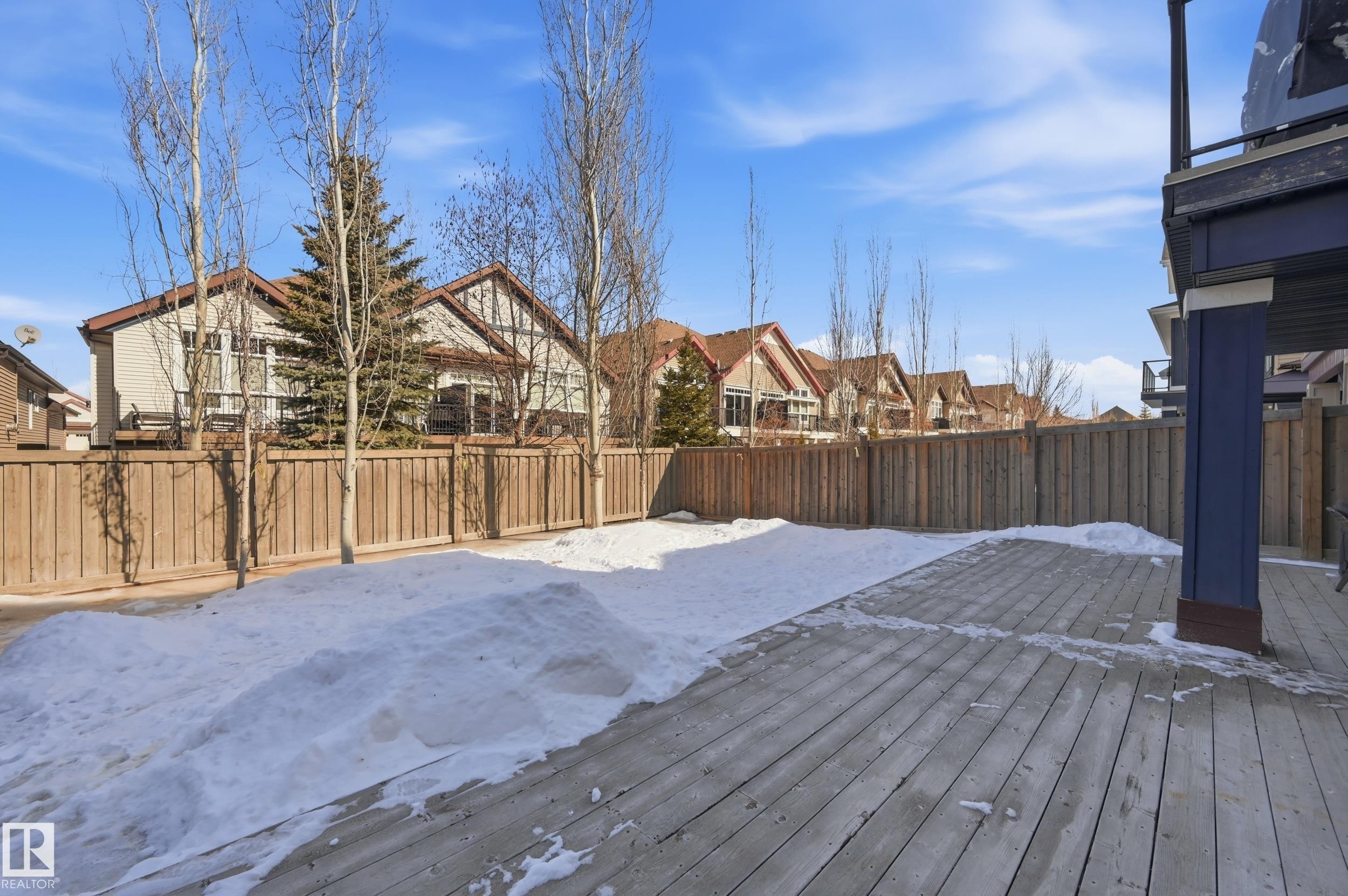 The property includes a spacious wood deck and a fenced yard - 2018 Armitage Green, Edmonton, AB - Outdoor With Deck Patio Veranda