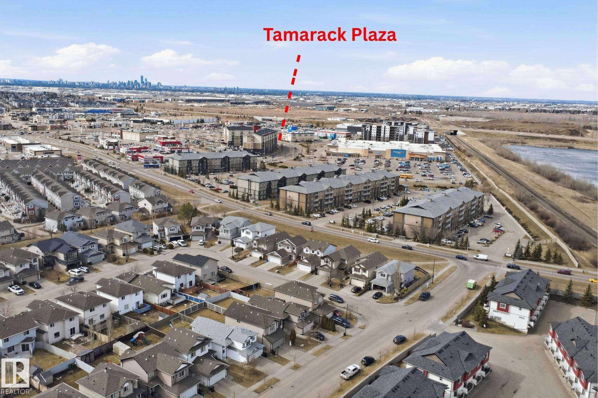 Aerial perspective showcasing a residential neighborhood with varied housing styles - 3533 11 Street, Edmonton, AB