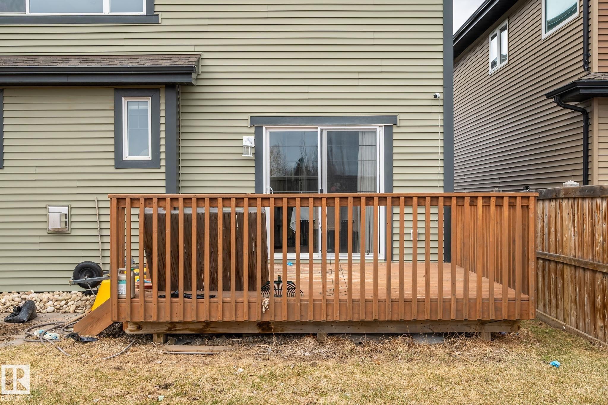 Wood deck with full railing and sliding glass door access - 8431 216 St Nw Nw, Edmonton, AB - Outdoor With Deck Patio Veranda With Exterior