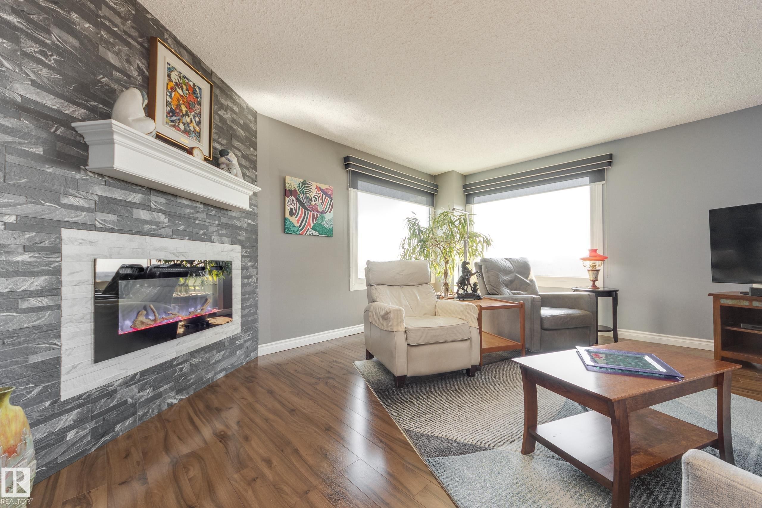 1406 12303 Jasper Avenue, Edmonton, AB - Indoor Photo Showing Living Room With Fireplace
