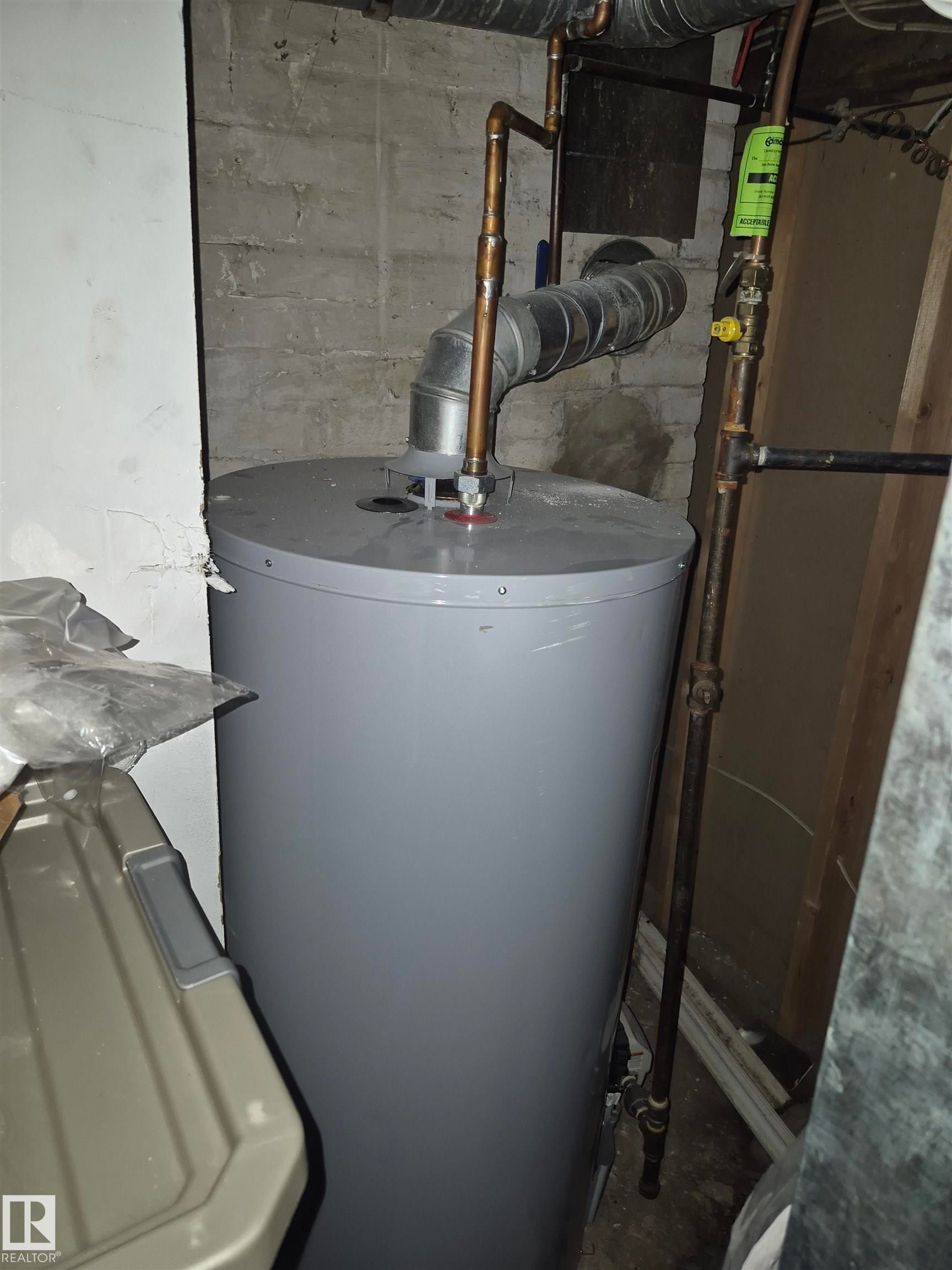 Water heater with copper piping and galvanized ductwork - 11301 87 Street, Edmonton, AB - Indoor Photo Showing Basement