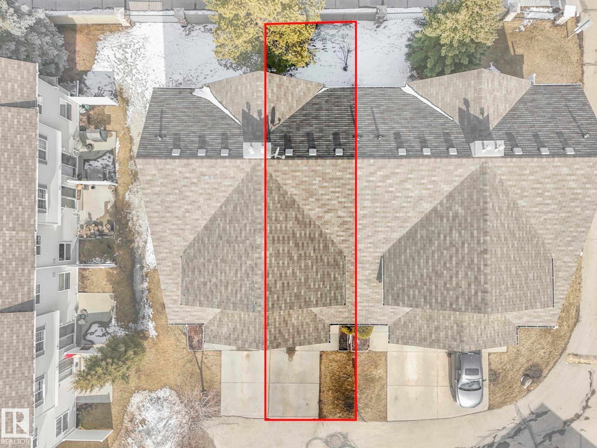 Aerial view of the property, showcasing the roofline and surrounding outdoor spaces - 175 150 Edwards Drive, Edmonton, AB - Outdoor