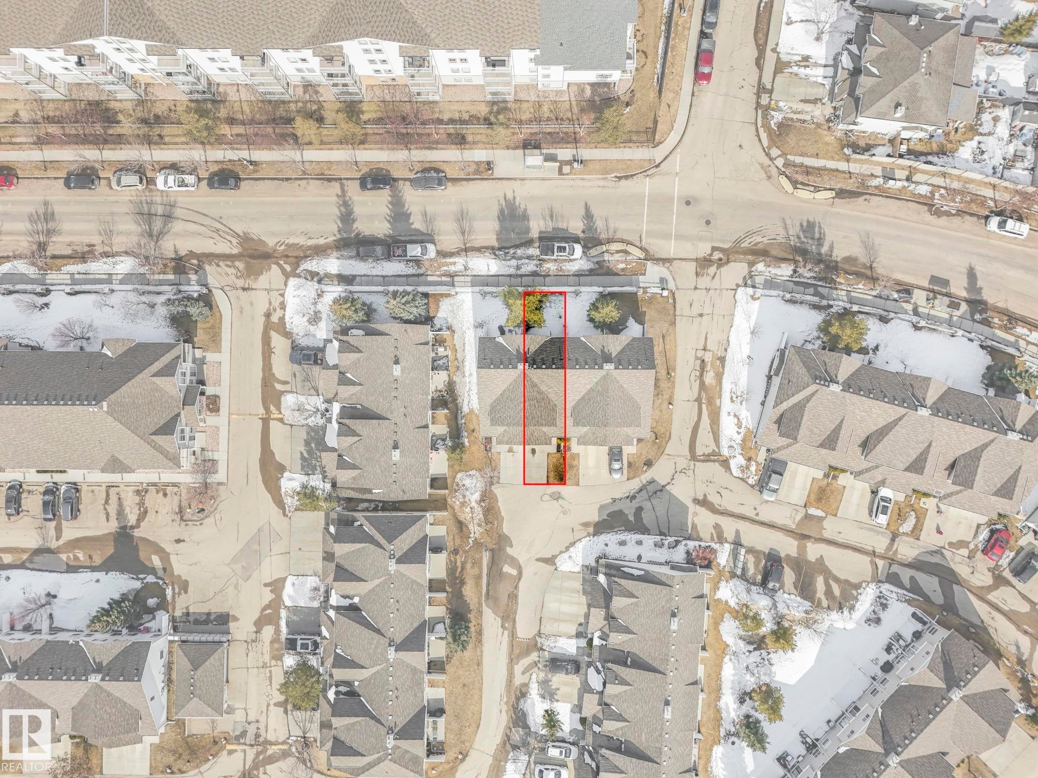 Aerial view of the property, featuring a paved driveway and a clear perimeter - 175 150 Edwards Drive, Edmonton, AB - Other