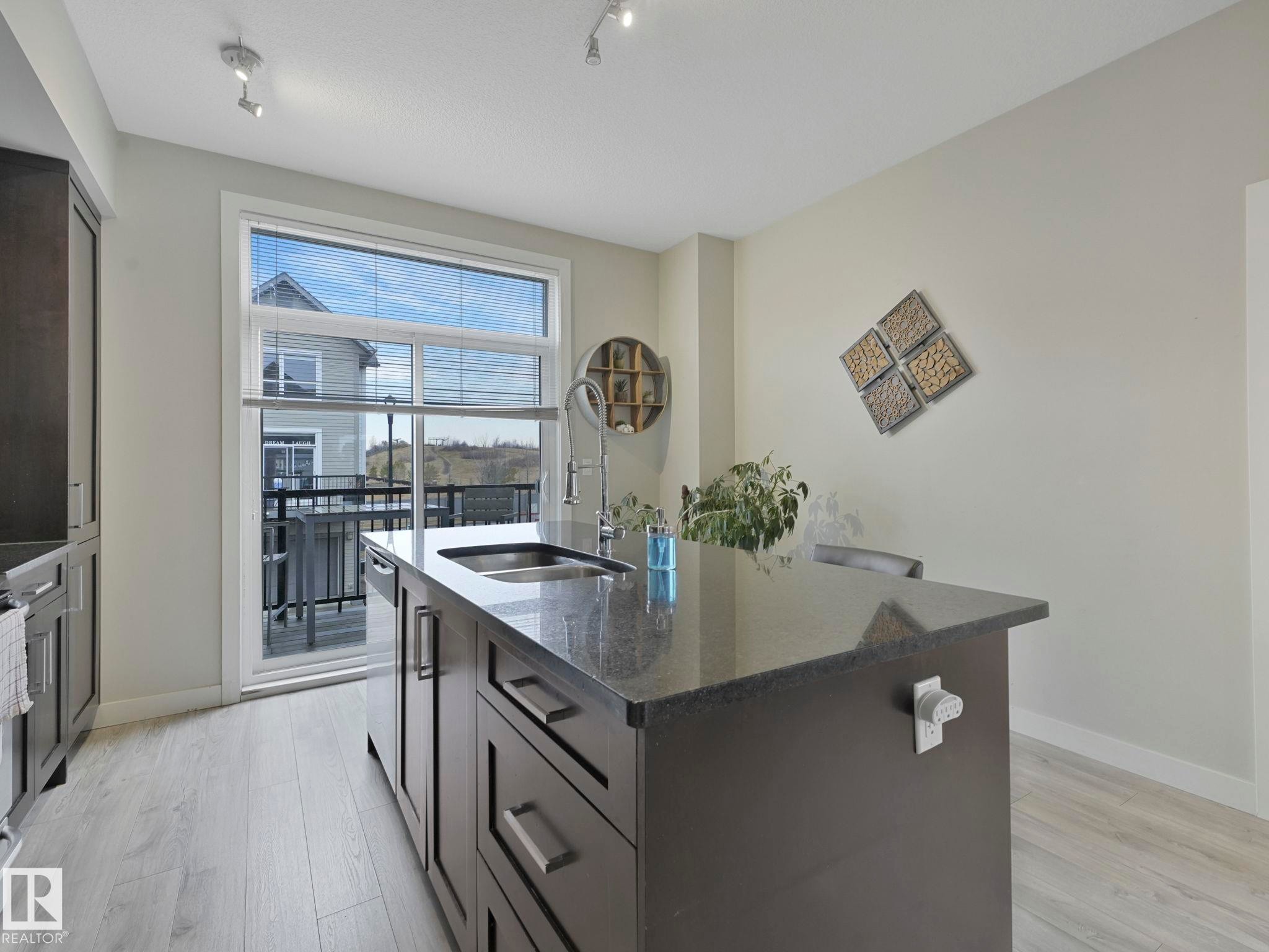 124 2560 Pegasus Boulevard, Edmonton, AB - Indoor Photo Showing Kitchen With Double Sink