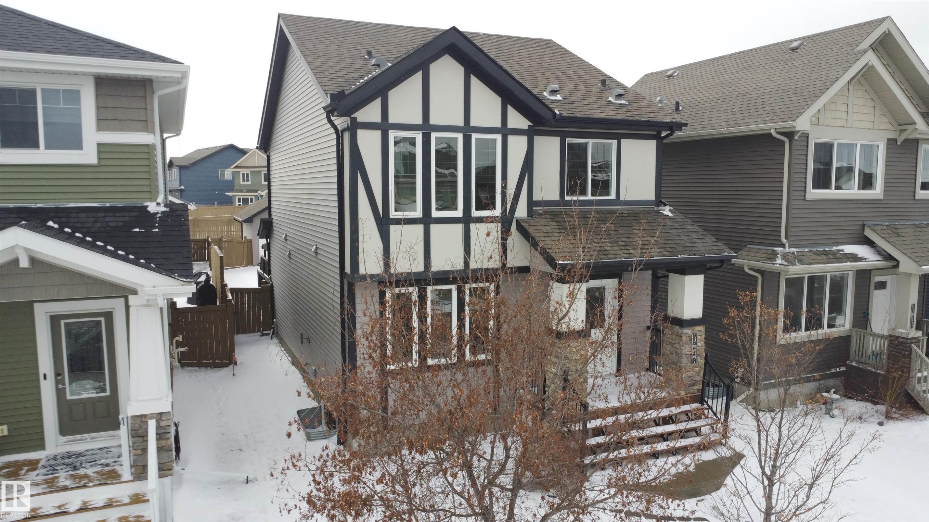 Two-story residence featuring a striking black and white facade with decorative half-timbering - 3609 Weidle Bend, Edmonton, AB - Outdoor