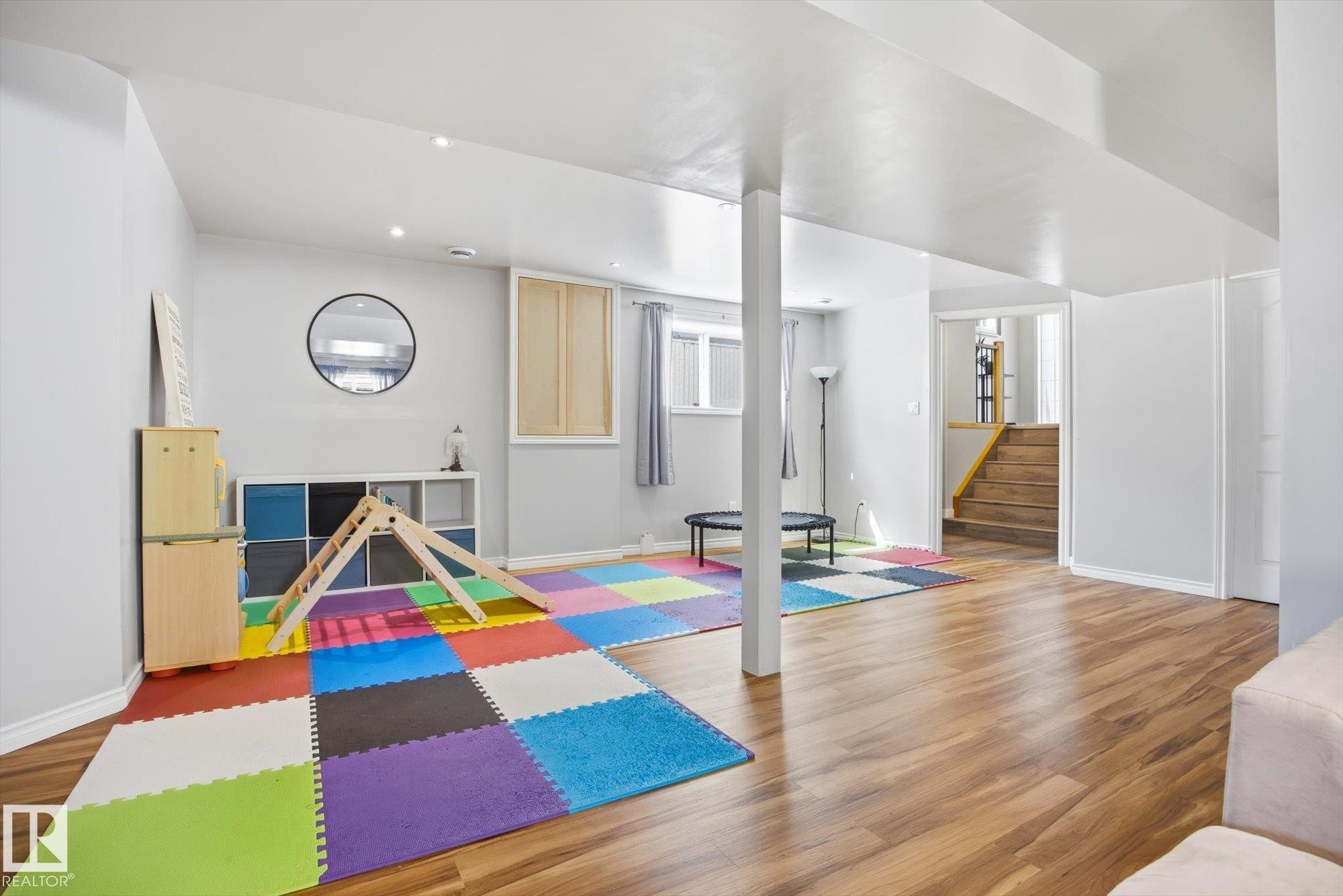 Spacious lower level featuring recessed lighting, light wood-finish flooring, and white baseboards - 2251 Brennan Court, Edmonton, AB - Indoor