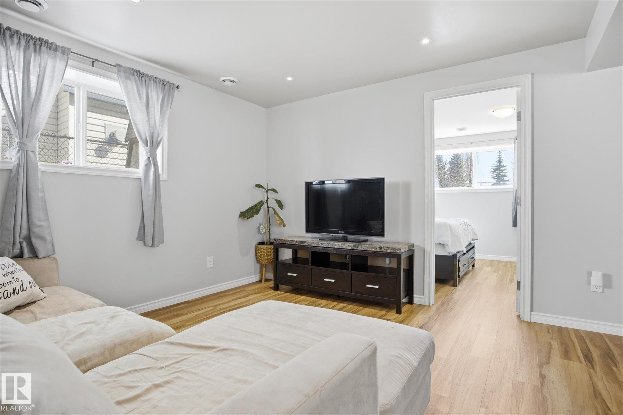Bright interior space featuring light wood-finish flooring and recessed ceiling lighting - 2251 Brennan Court, Edmonton, AB - Indoor Photo Showing Bedroom