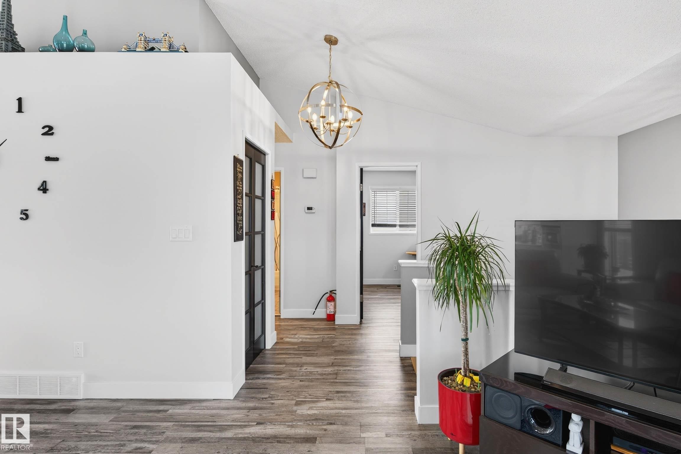 The interior features vaulted ceilings and light-toned walls, creating an open and airy feel - 34 Donald Place, St. Albert, AB - Indoor Photo Showing Other Room