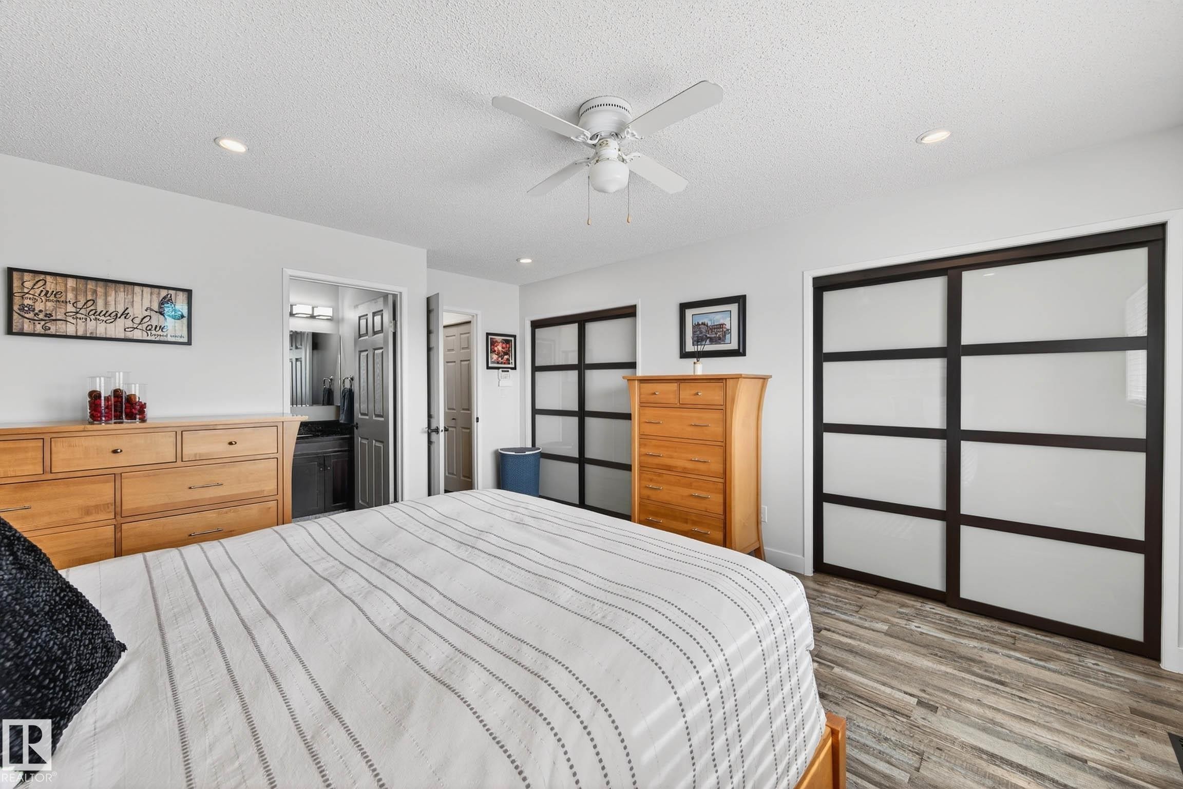 The property features a bedroom with light-toned flooring, a ceiling fan with integrated lighting, and recessed lighting - 34 Donald Place, St. Albert, AB - Indoor Photo Showing Bedroom