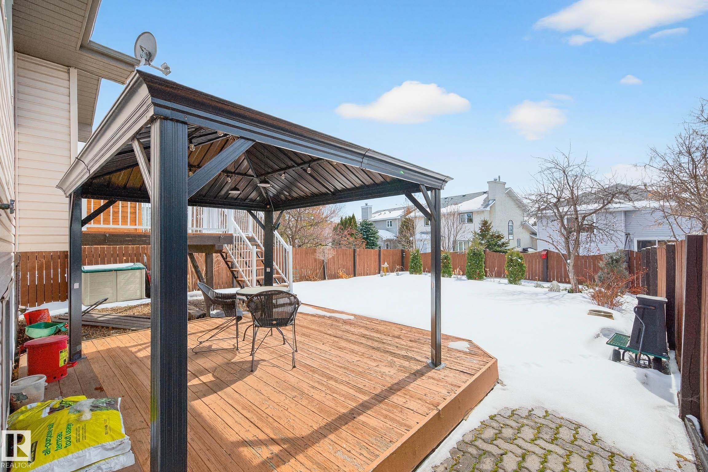 The property features a spacious wooden deck with a gazebo, ideal for outdoor enjoyment - 34 Donald Place, St. Albert, AB - Outdoor With Deck Patio Veranda With Exterior