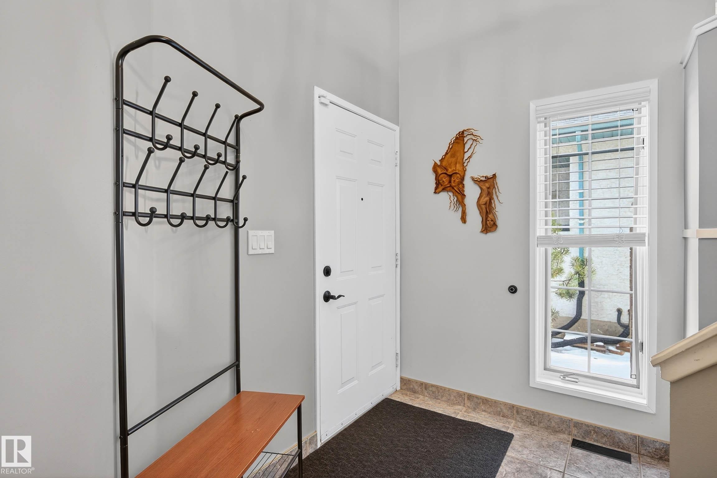 Entryway featuring a white door, a window with blinds, and tiled flooring - 34 Donald Place, St. Albert, AB - Indoor Photo Showing Other Room