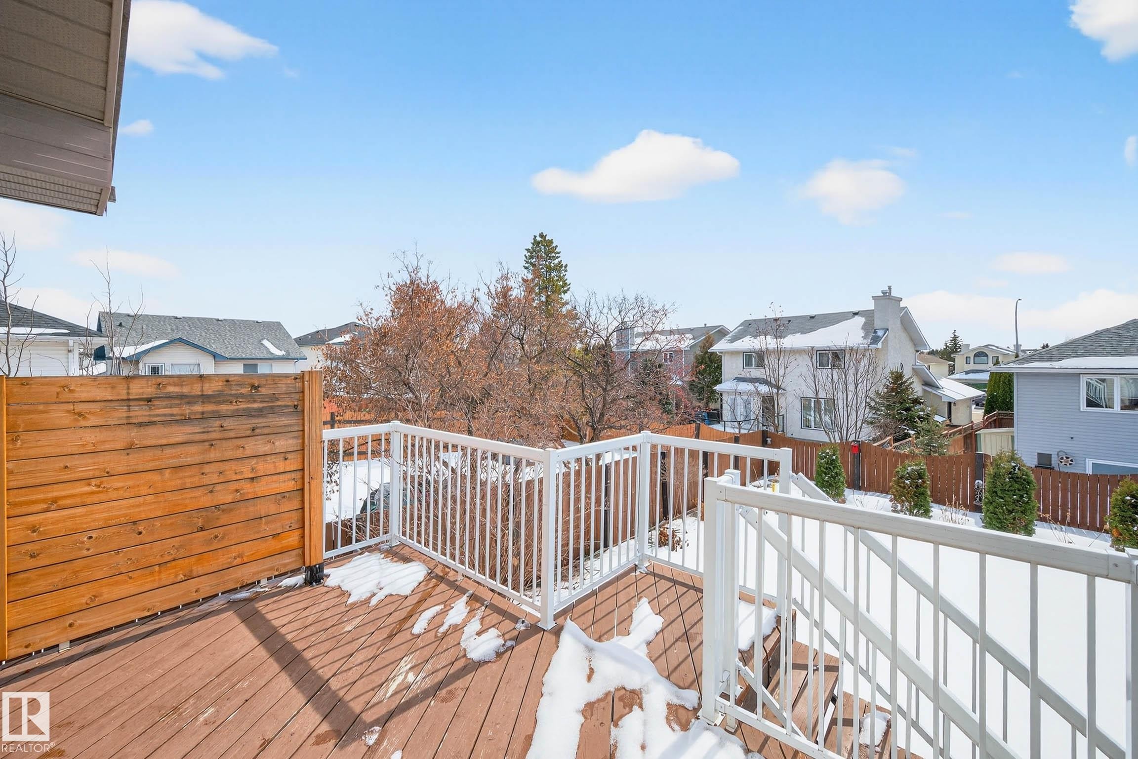The property features a spacious outdoor deck with a wooden privacy screen and white railings - 34 Donald Place, St. Albert, AB - Outdoor With Deck Patio Veranda With Exterior