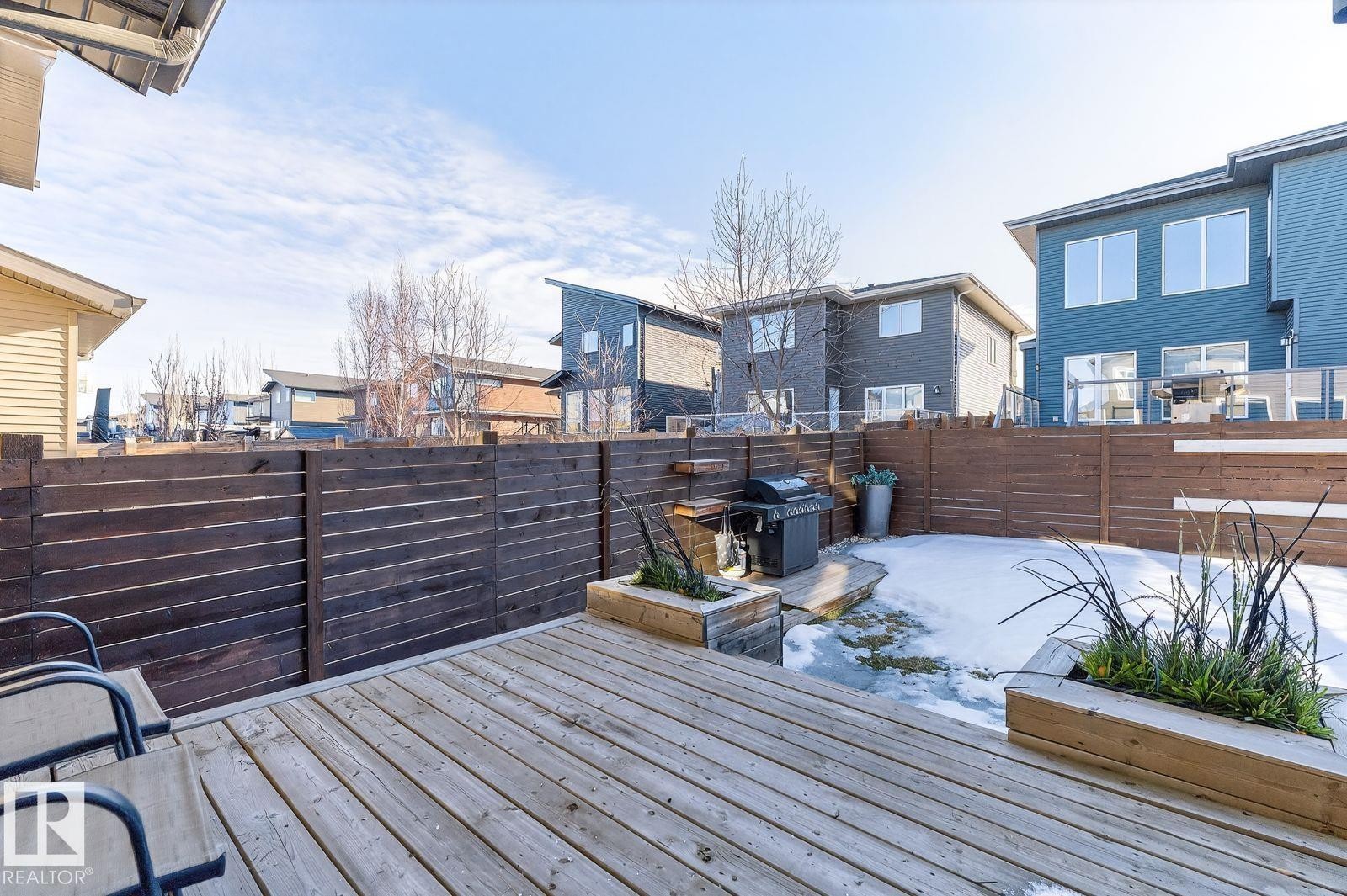 Spacious outdoor deck with natural wood planks - 793 Windermere Wynd, Edmonton, AB - Outdoor With Deck Patio Veranda With Exterior