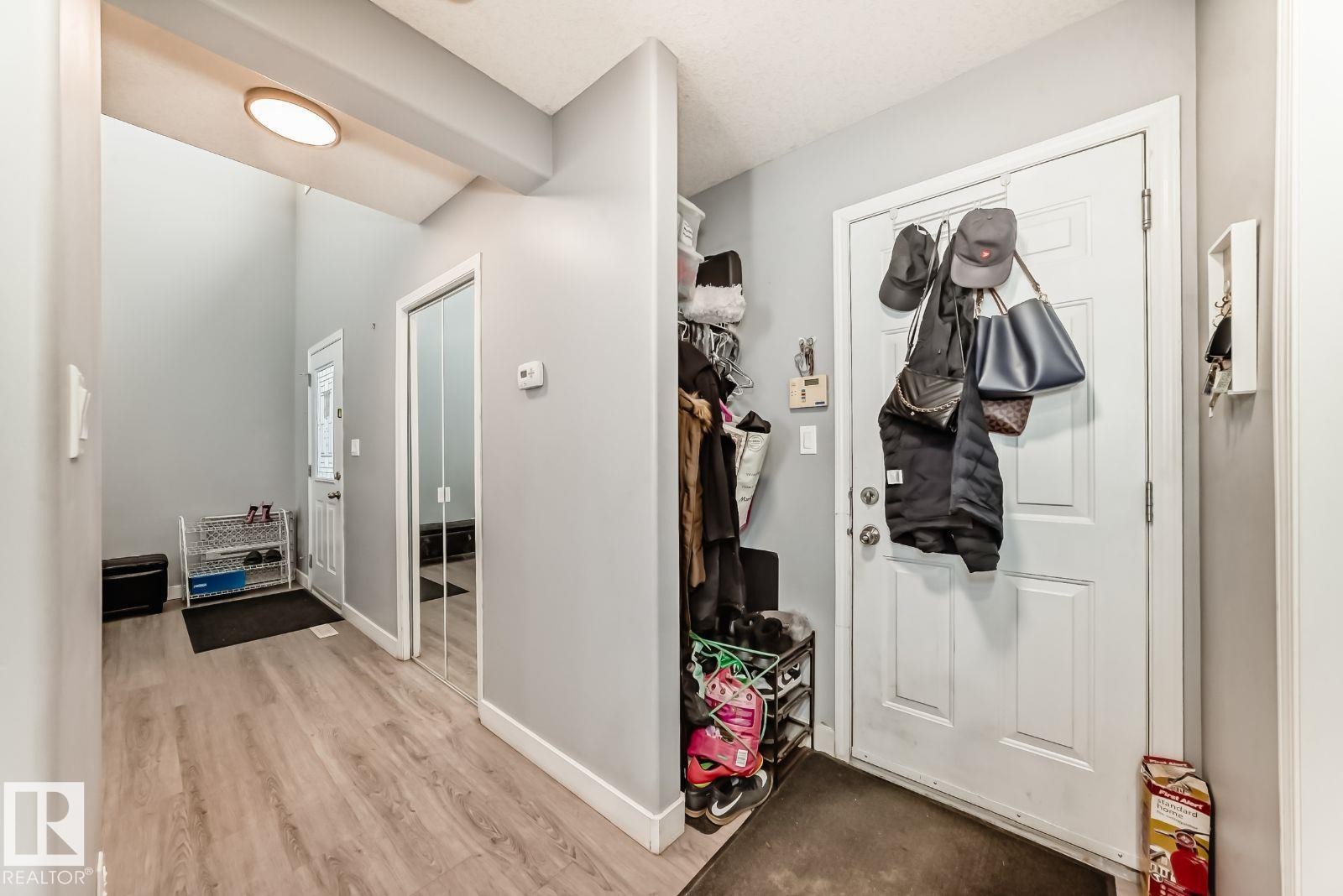 Entryway featuring light wood-finish flooring and light gray walls - 715 Hudson Place, Edmonton, AB - Indoor Photo Showing Other Room
