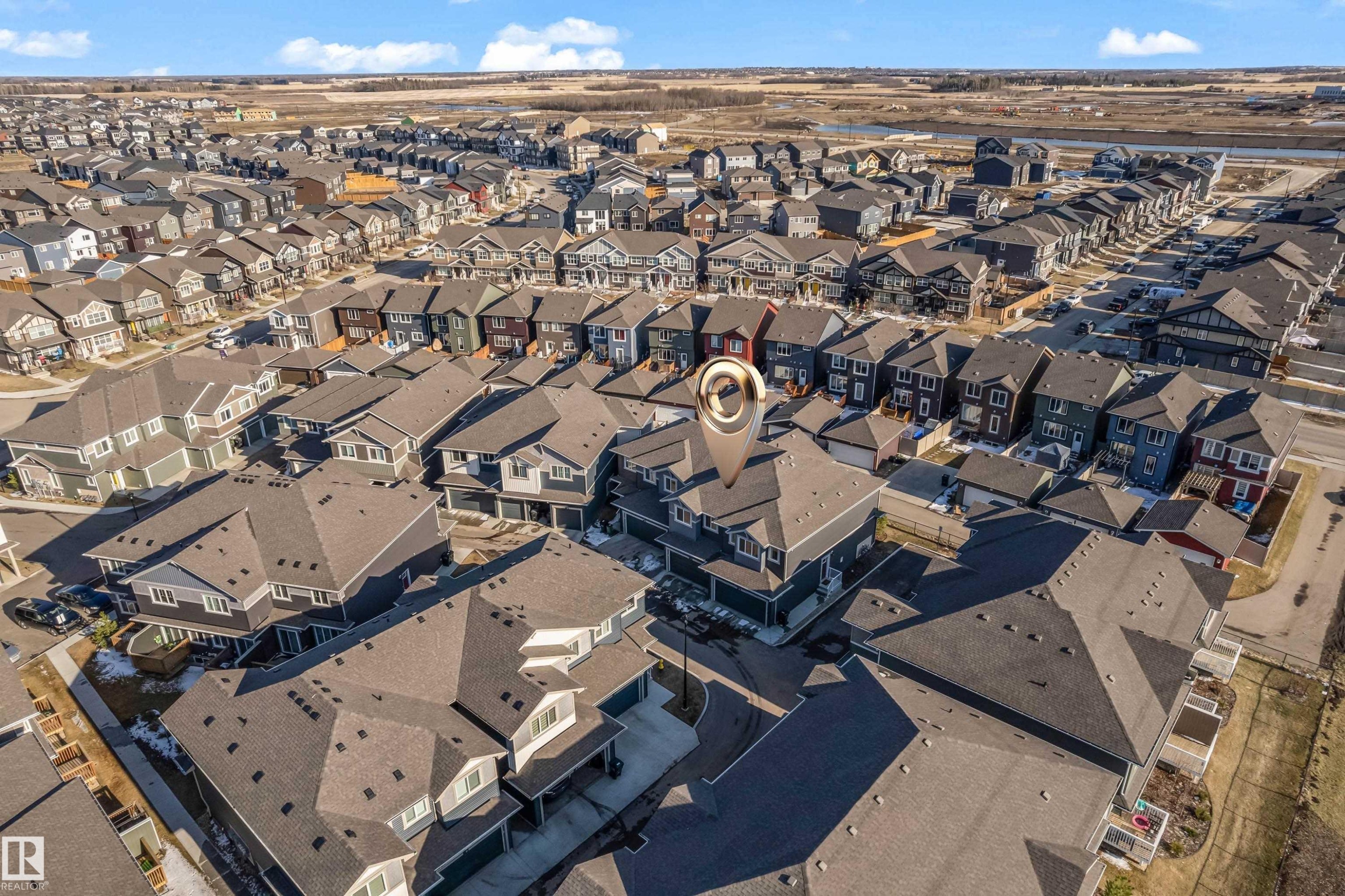 Residential neighborhood featuring a mix of single-family homes and townhomes, and visible street parking - 41 603 Orchards Boulevard, Edmonton, AB - Outdoor With View