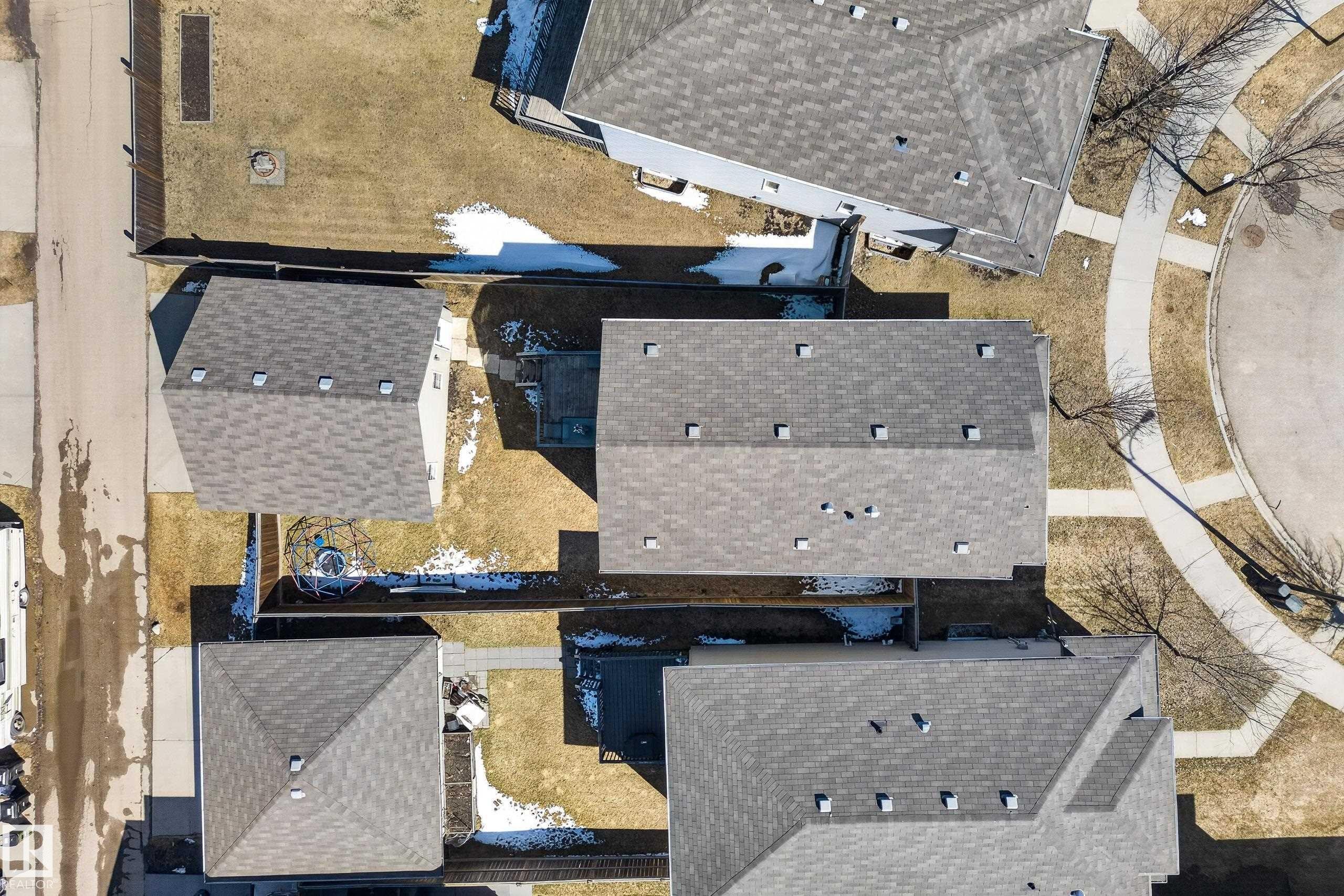 Aerial perspective showcasing multiple properties with gray shingle roofing - 1148 35 Avenue, Edmonton, AB - Outdoor