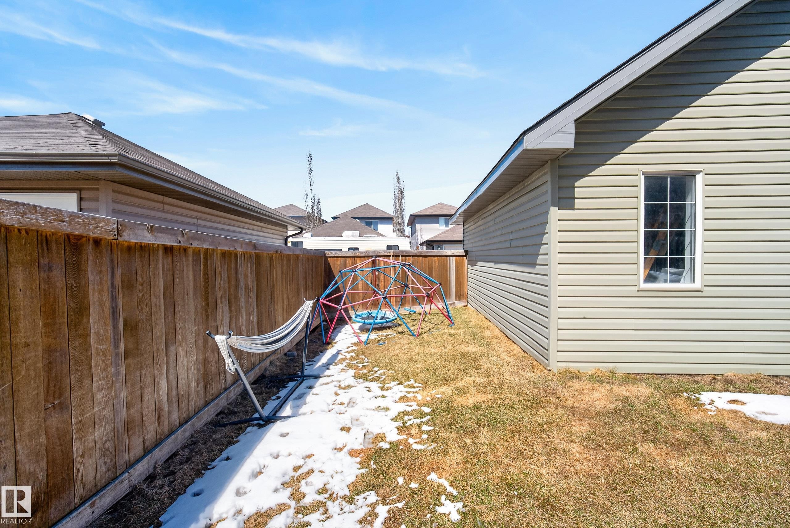 Exterior siding in a neutral tone with a white-framed window - 1148 35 Avenue, Edmonton, AB - Outdoor With Exterior