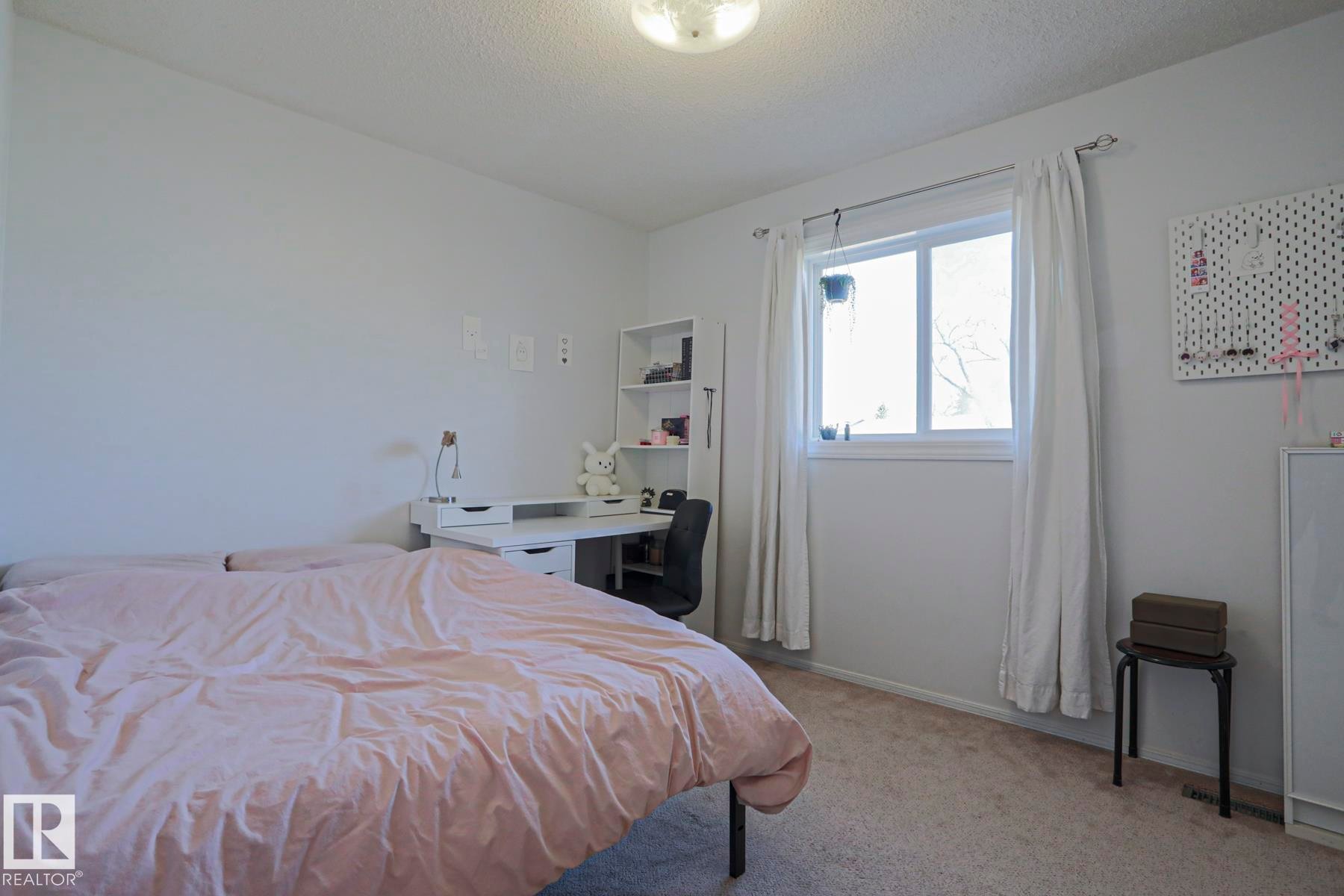 Carpeted room with a double window and white curtains - 2433 89 Street, Edmonton, AB - Indoor Photo Showing Bedroom