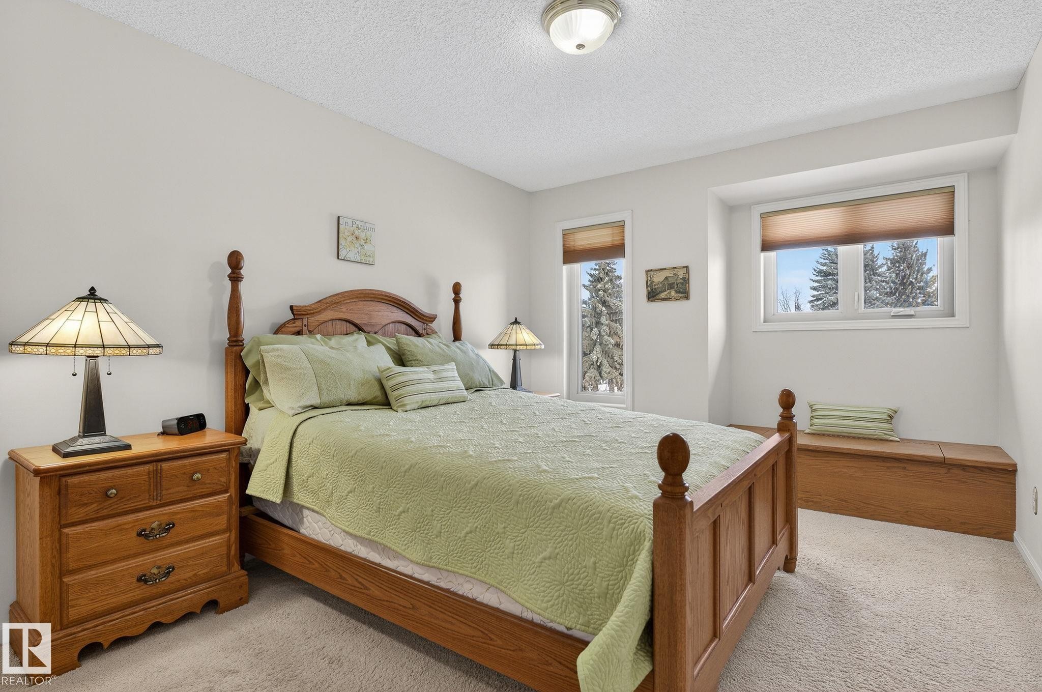 Bedroom featuring neutral wall paint, white trim, and light-toned carpeting - 848 Wheeler Road W, Edmonton, AB - Indoor Photo Showing Bedroom