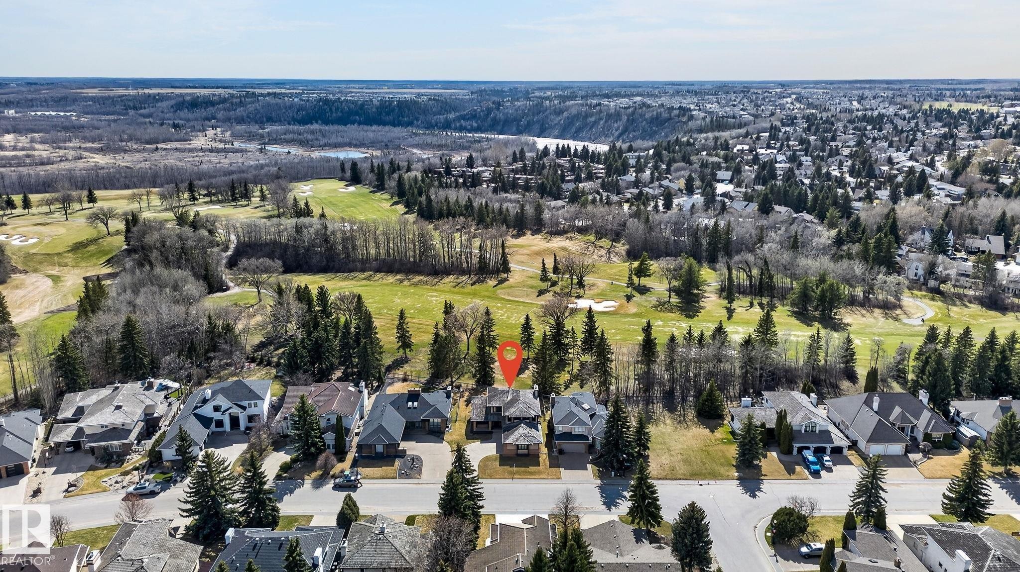 Residential property featuring a multi-level design with a light-colored exterior and dark-toned roofing - 848 Wheeler Road W, Edmonton, AB - Outdoor With View