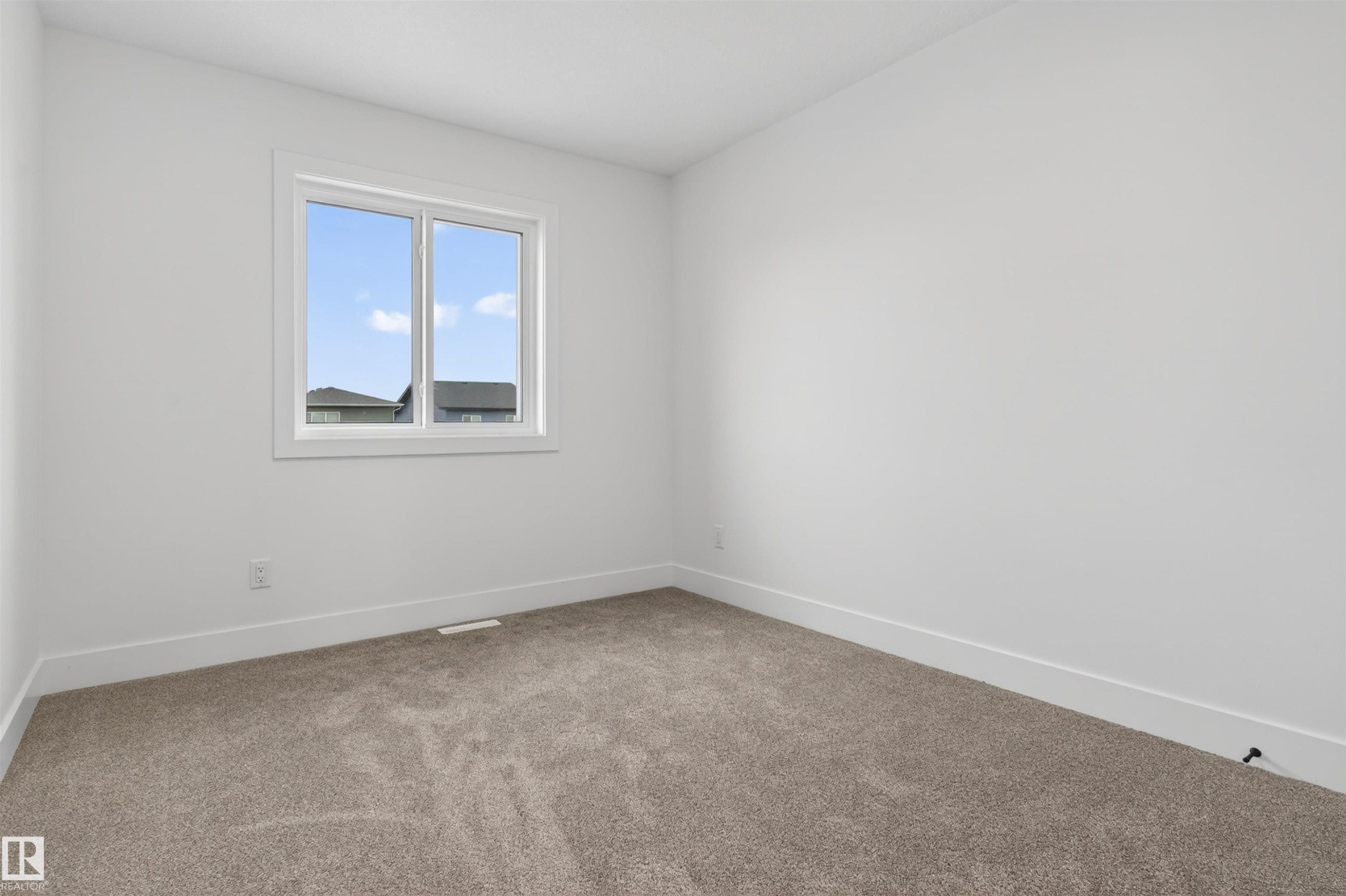 Neutral-toned carpet flooring - 45 River Birch, St. Albert, AB - Indoor Photo Showing Other Room