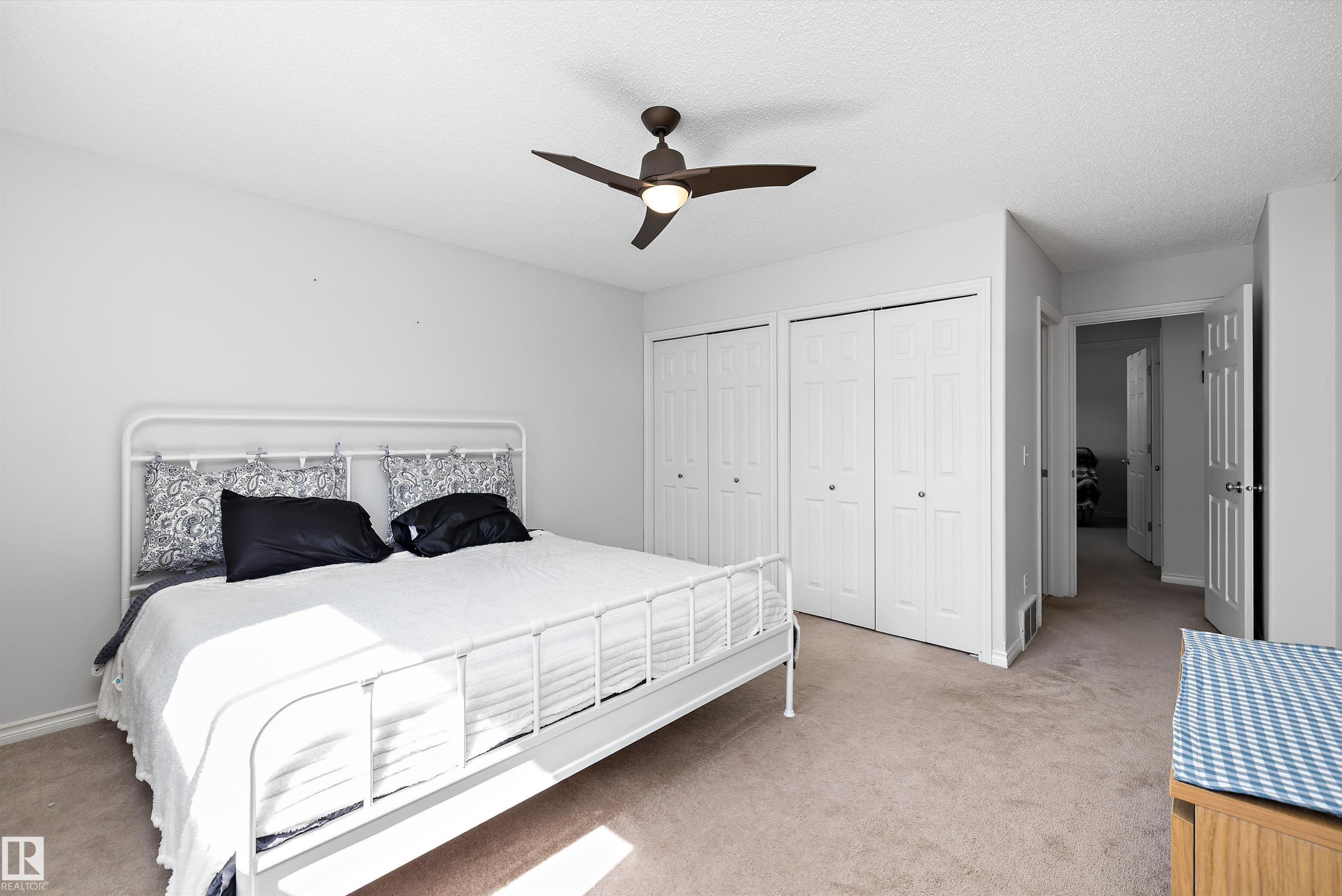 Neutral-toned carpeting complements the light gray walls - 1811 37 Avenue, Edmonton, AB - Indoor Photo Showing Bedroom