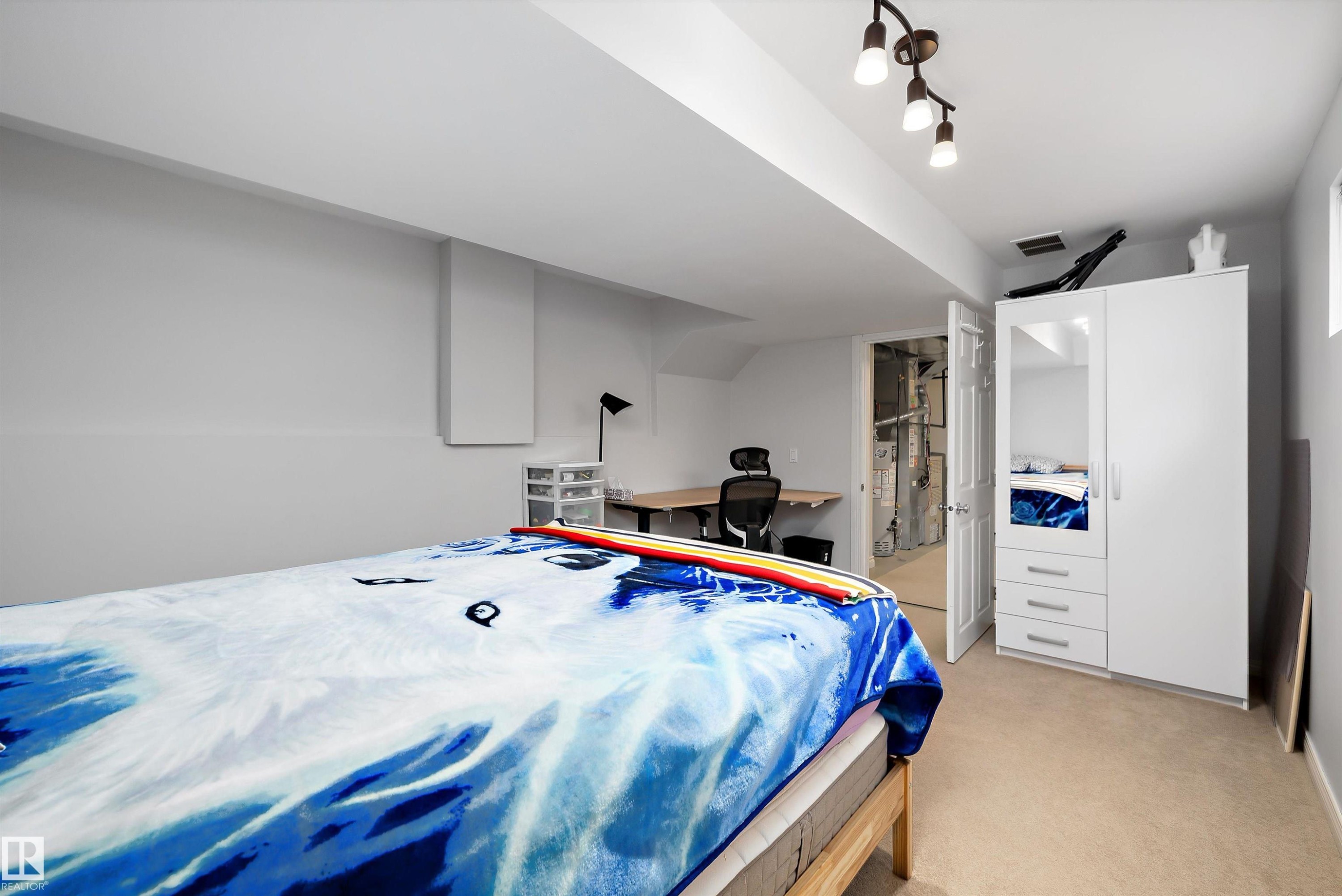 Carpeted room with recessed lighting and a built-in desk - 1811 37 Avenue, Edmonton, AB - Indoor Photo Showing Bedroom