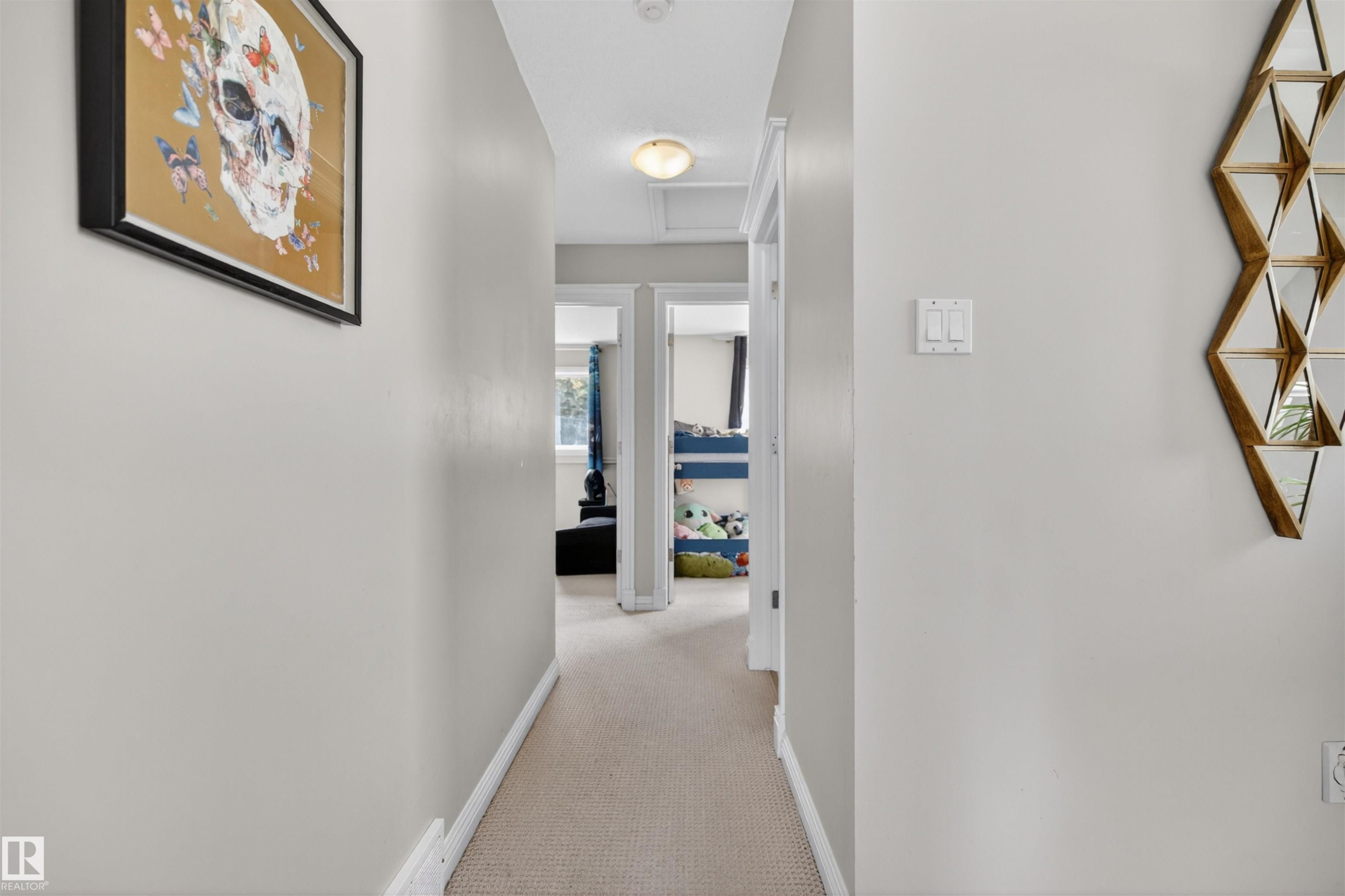 This hallway features light-colored walls and carpeted flooring, creating a bright and inviting atmosphere - 2 Sturgeon Road, St. Albert, AB - Indoor Photo Showing Other Room
