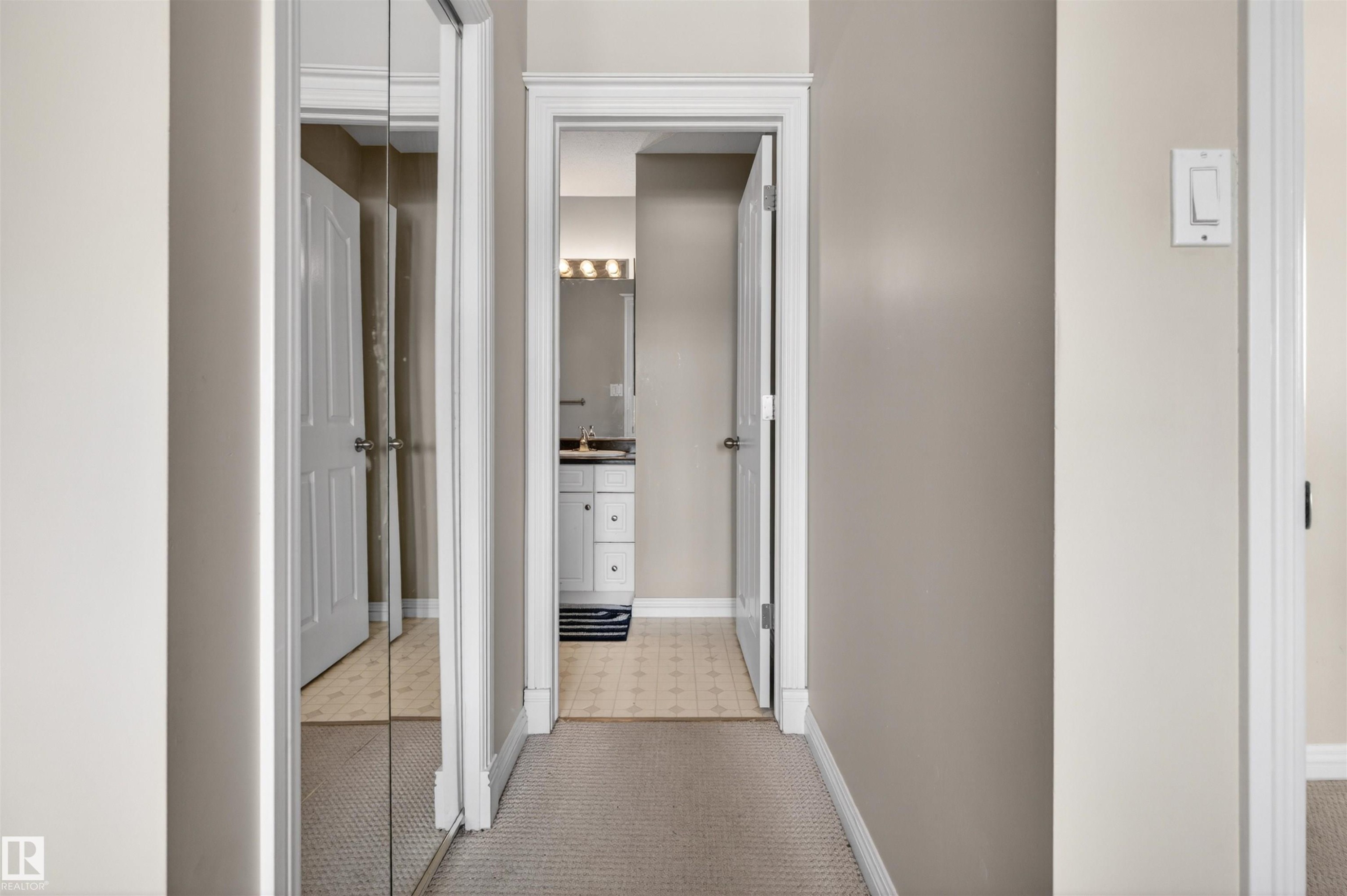 Hallway featuring carpeted flooring and walls painted in a neutral tone - 2 Sturgeon Road, St. Albert, AB - Indoor Photo Showing Other Room