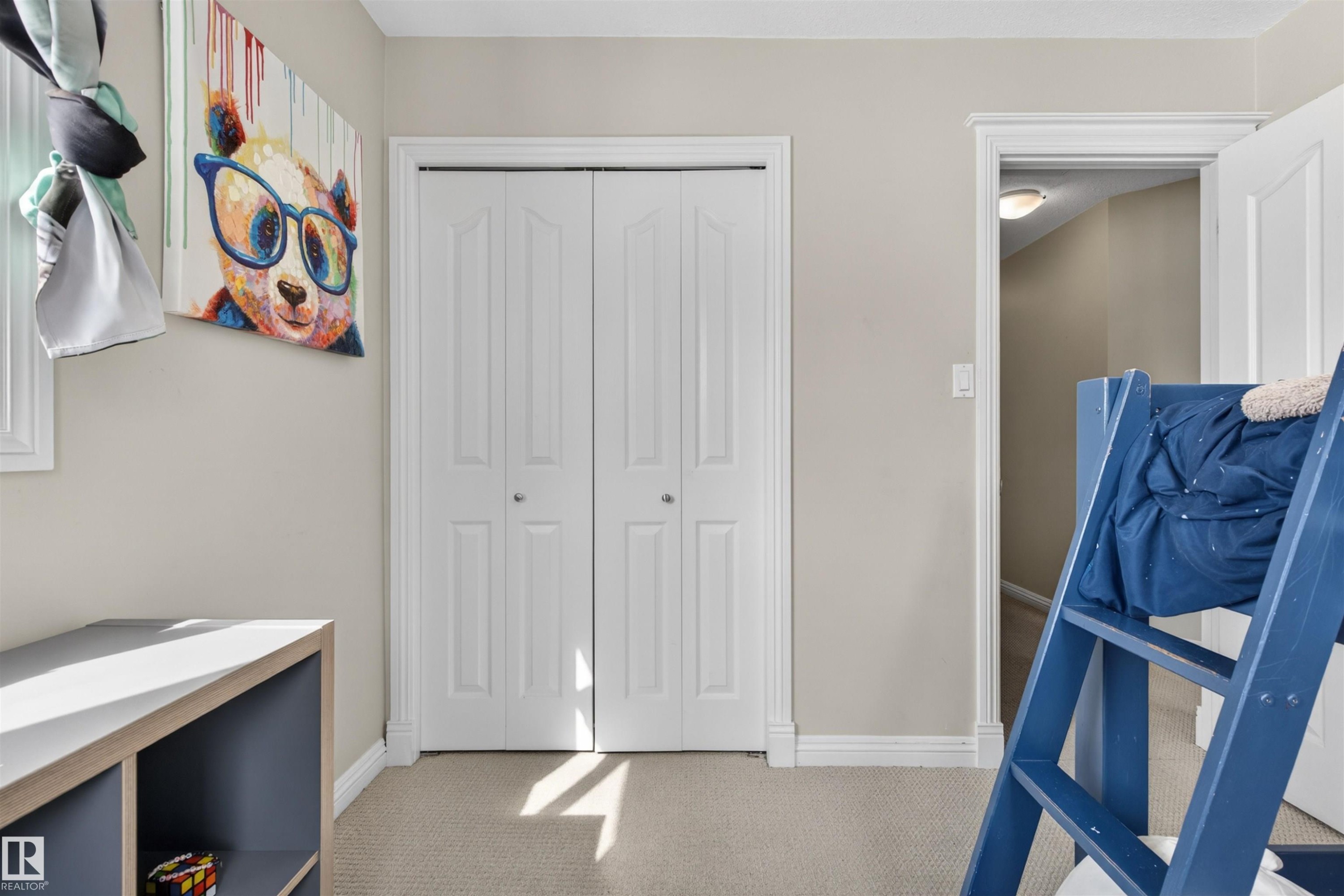 This room features light-colored carpeting, a white bi-fold closet, and baseboard molding - 2 Sturgeon Road, St. Albert, AB - Indoor Photo Showing Other Room