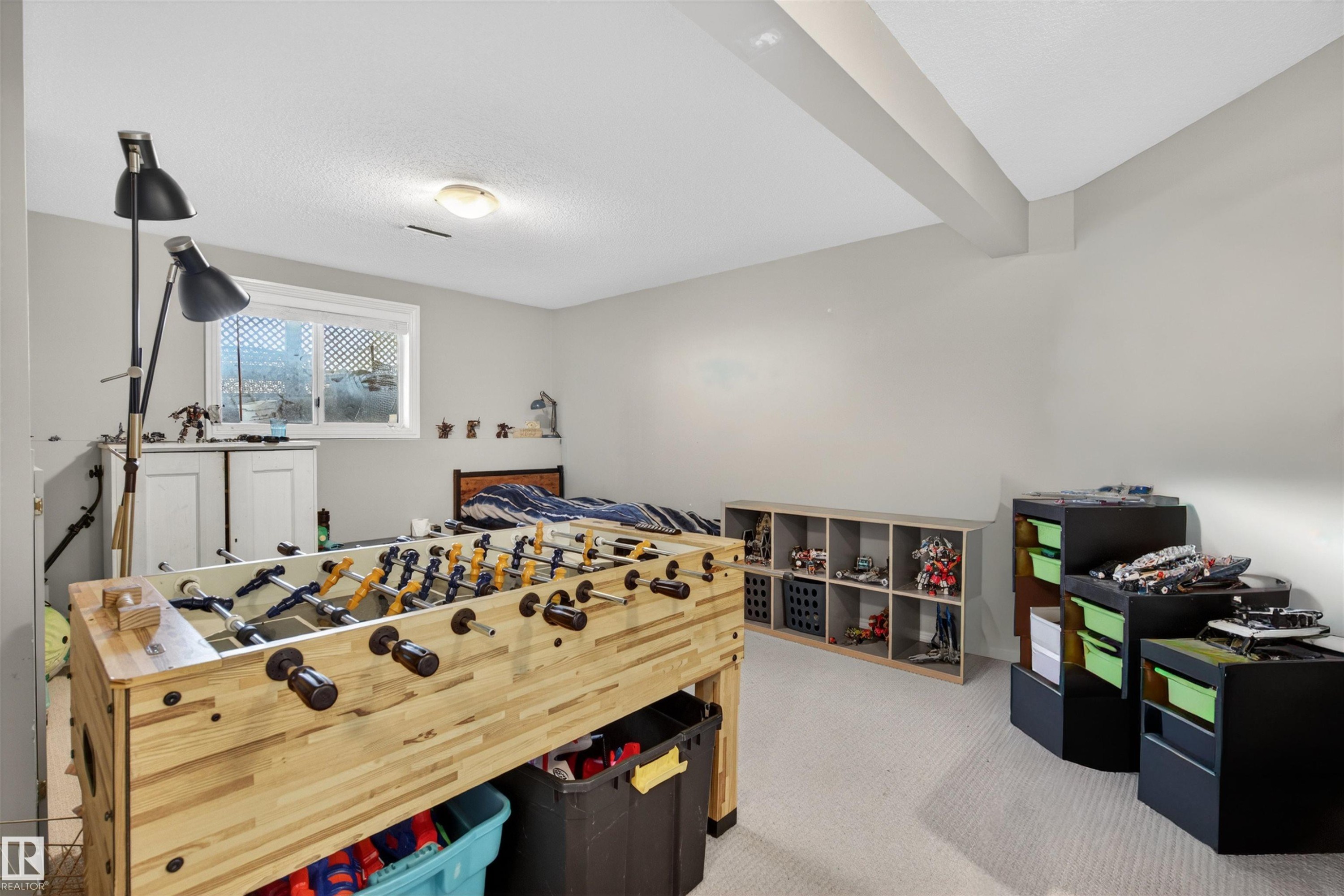 This room features light-colored walls and carpeting, with a window providing natural light - 2 Sturgeon Road, St. Albert, AB - Indoor