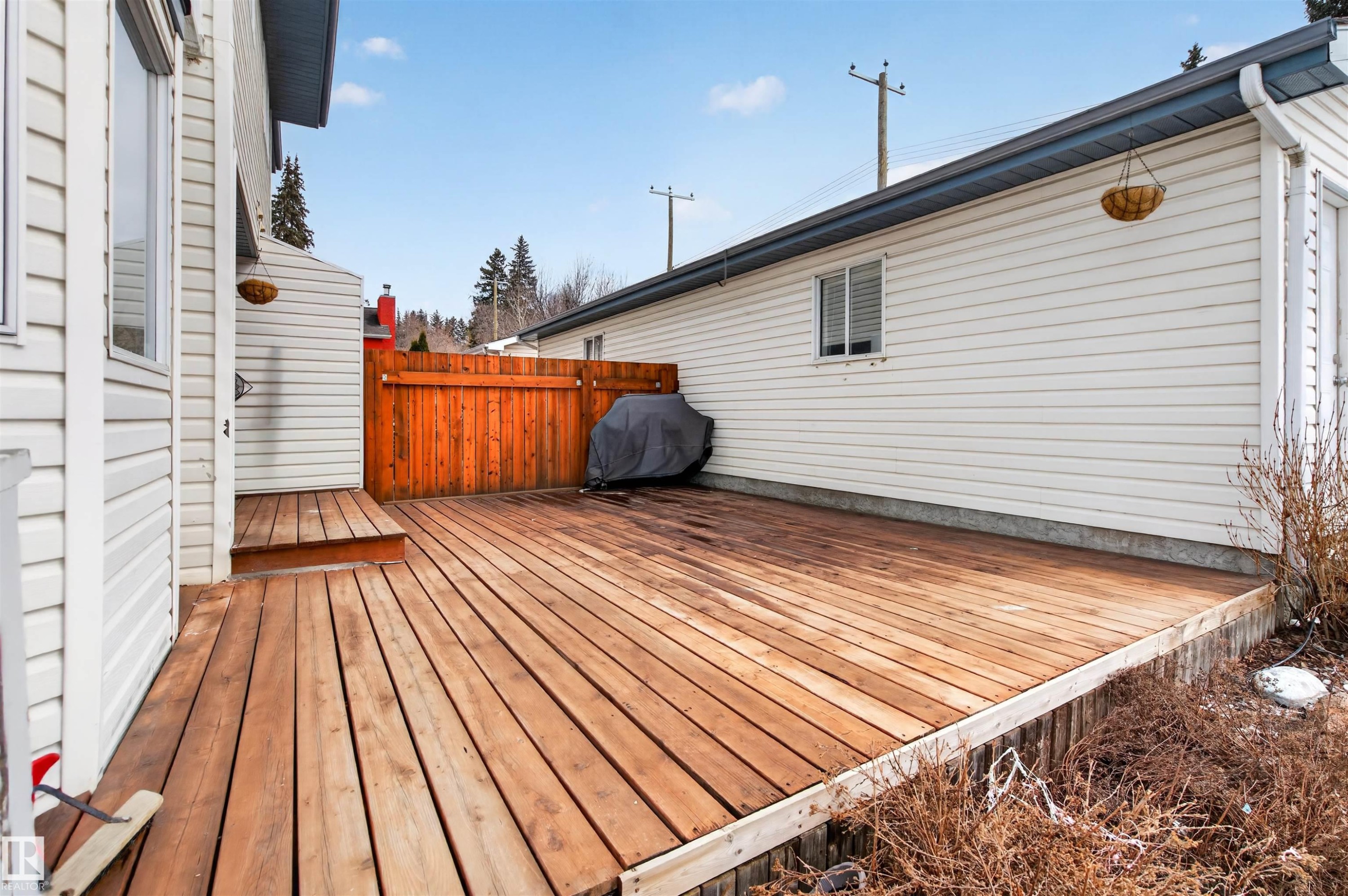 The property features an outdoor wooden deck with a privacy fence - 2 Sturgeon Road, St. Albert, AB - Outdoor With Exterior