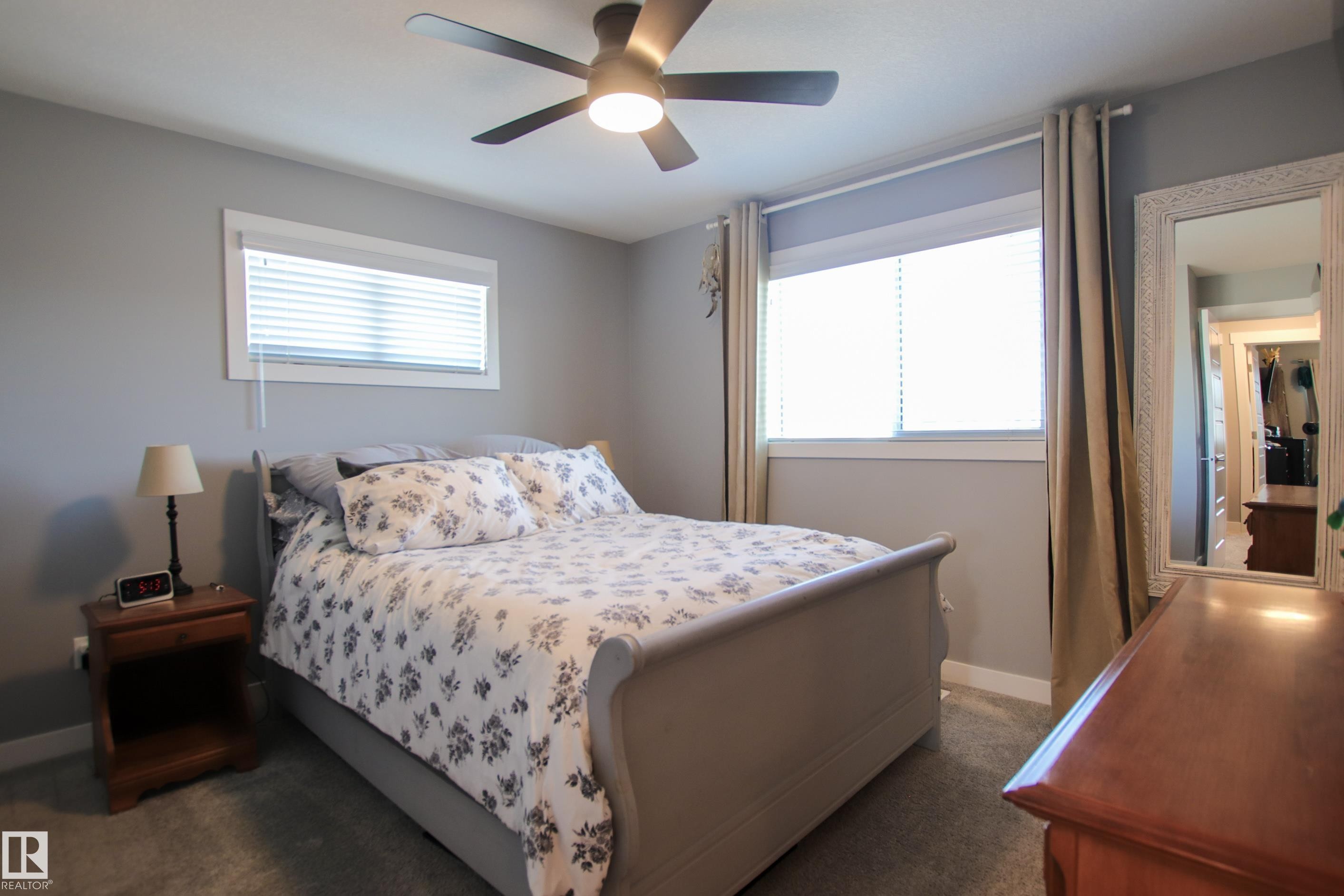 Room featuring neutral gray walls, gray carpet, and a white ceiling - 3805 170A Avenue, Edmonton, AB - Indoor Photo Showing Bedroom