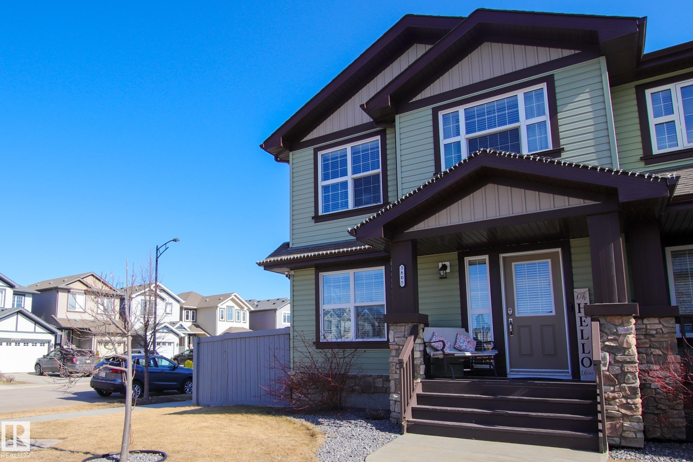 Multi-story residence featuring light green siding and dark trim - 3805 170A Avenue, Edmonton, AB - Outdoor With Deck Patio Veranda With Facade