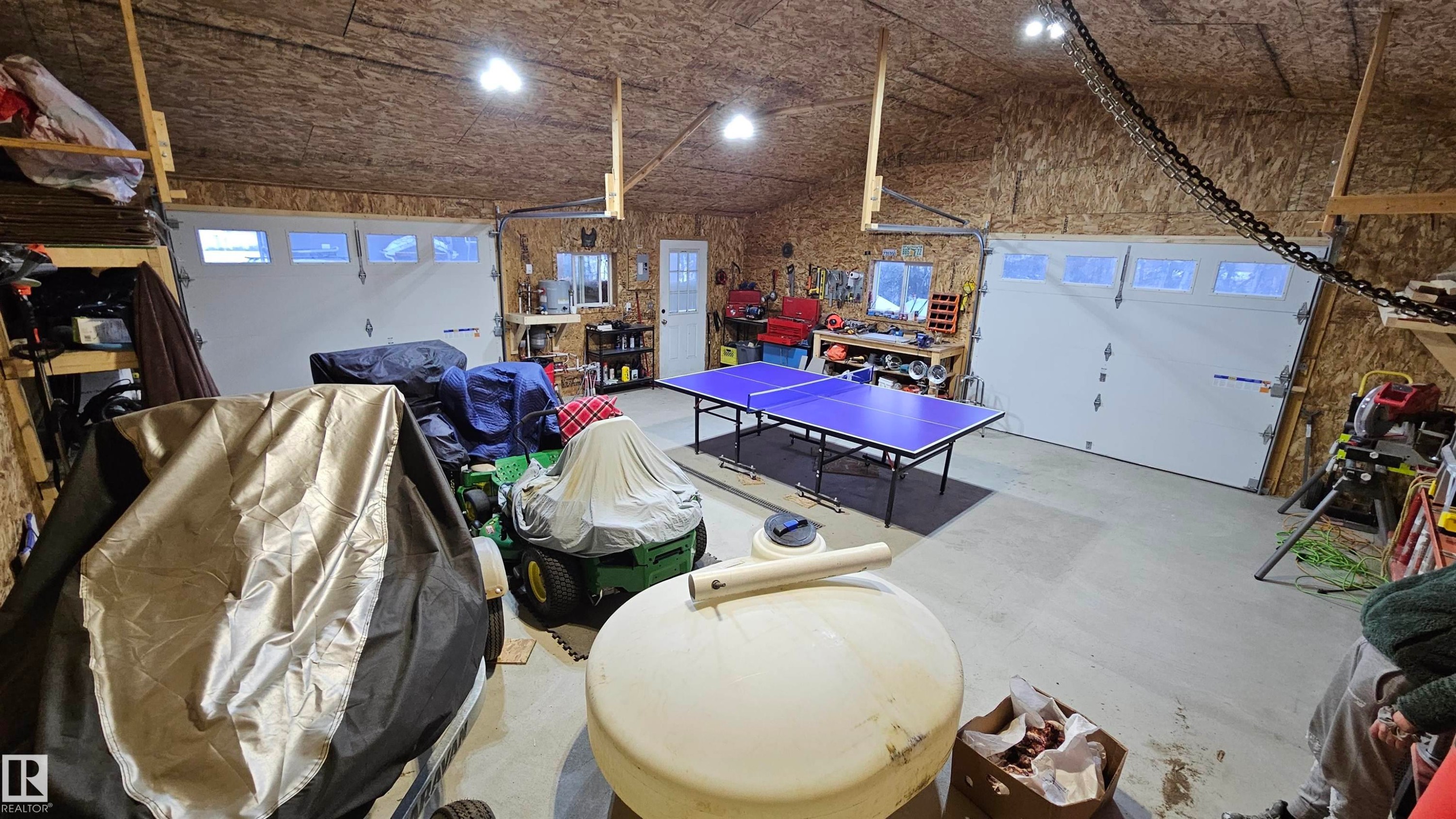 26x26 Oversized garage with in floor heat, 2 overhead doors and floor drain - 58513 Range Road 231, Rural Thorhild County, AB - Indoor Photo Showing Garage