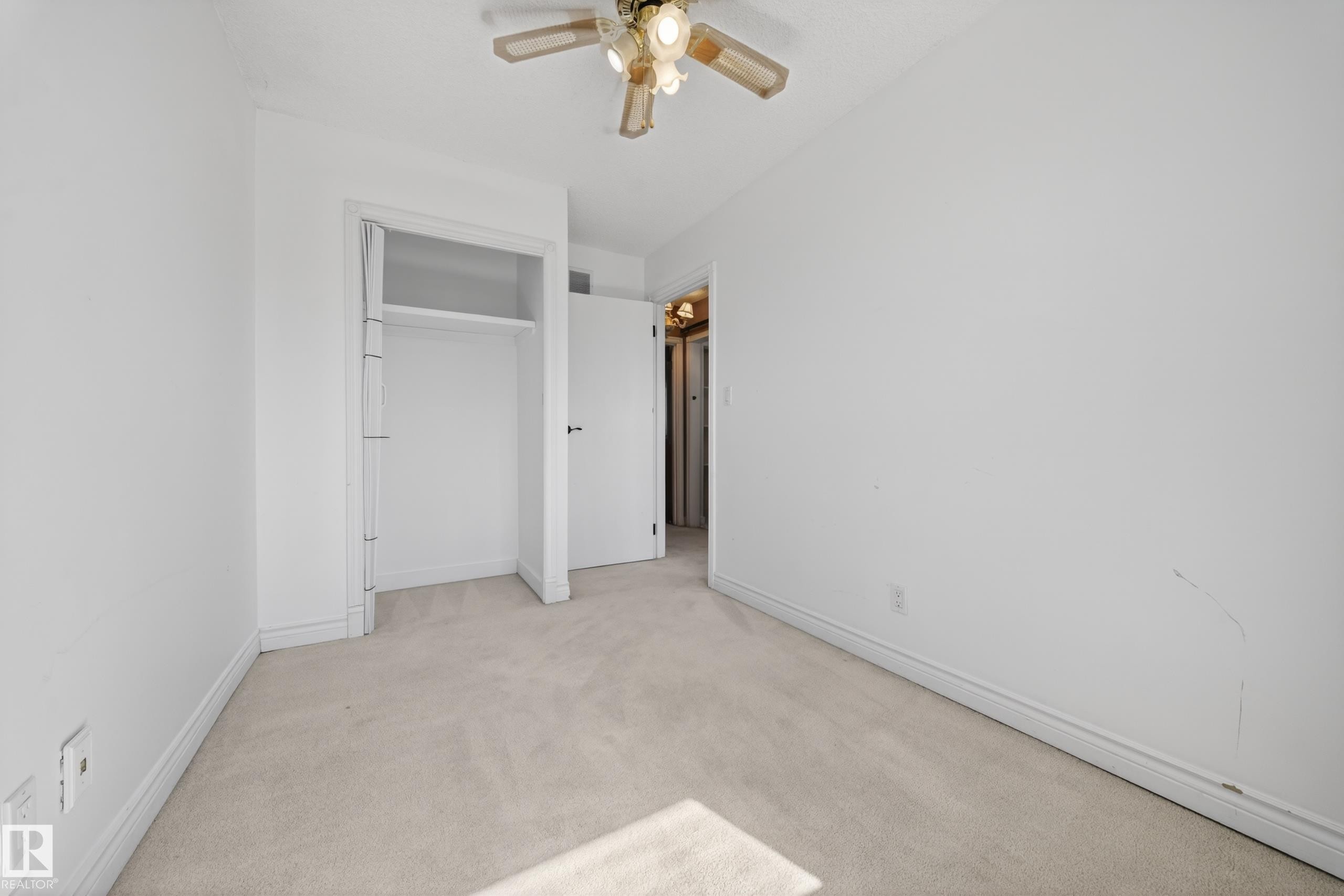 Neutral tone carpeting extending throughout the room - 1767 61 Street, Edmonton, AB - Indoor Photo Showing Other Room